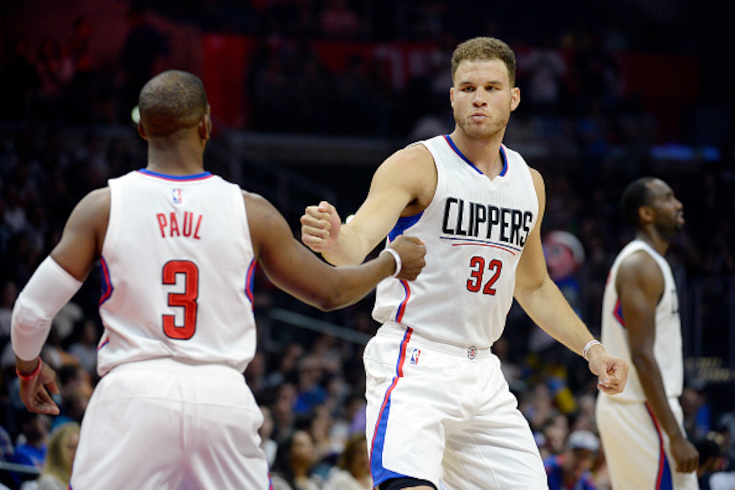 LOS ANGELES, CA - APRIL 3: Blake Griffin #32 of the Los Angeles Clippers pumps fists with Chris Paul #3 as he starts the basketball game against The Washington Wizards at Staples Center April 3, 2016, in Los Angeles, California. Griffin rejoined the Clipp