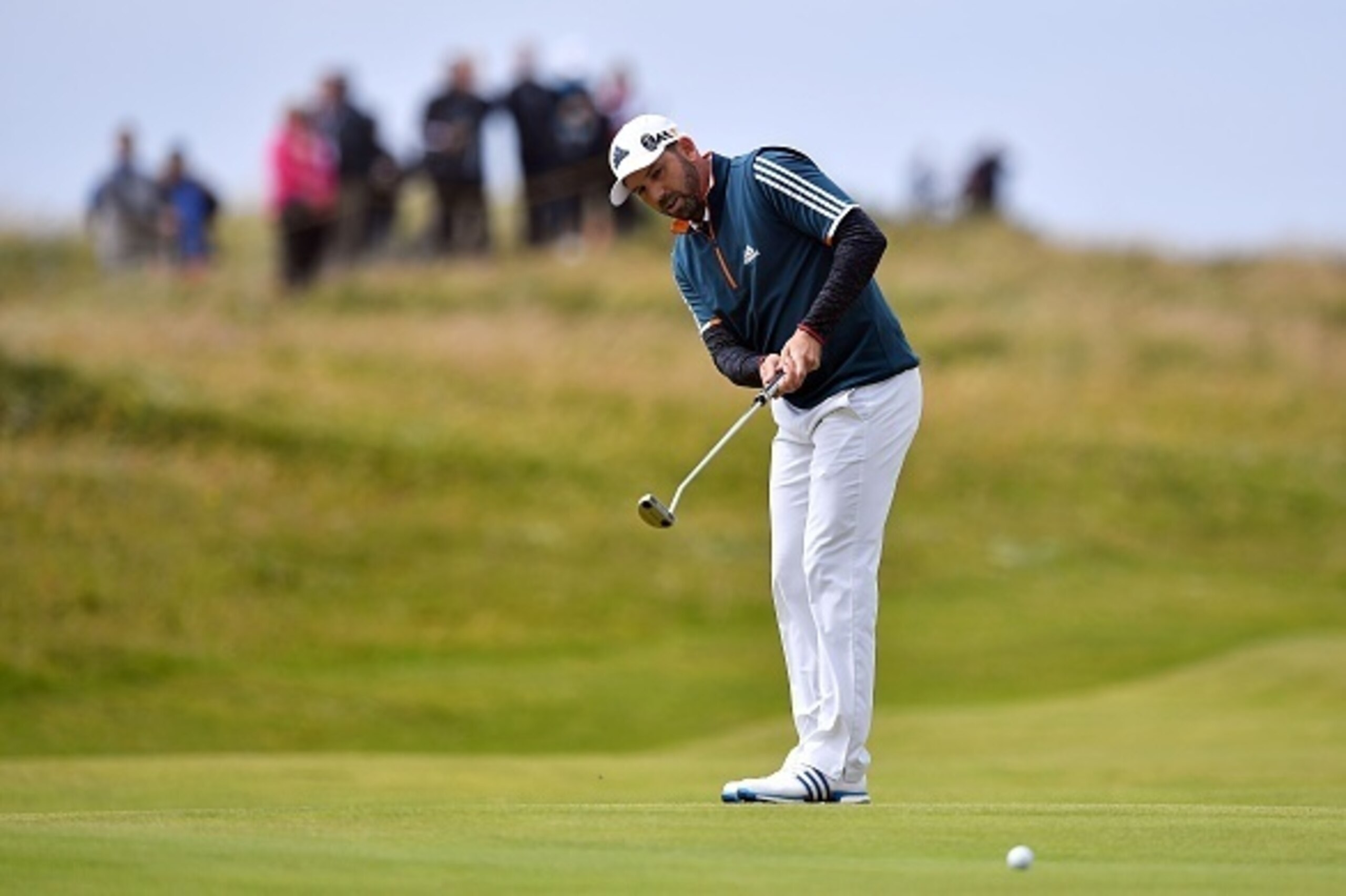 Spain's Sergio Garcia lines putts on the 4th green during his final round on day four of the 2016 British Open Golf Championship at Royal Troon in Scotland on July 17, 2016.
Troon has seen just about everything in terms of weather so far this week, with g