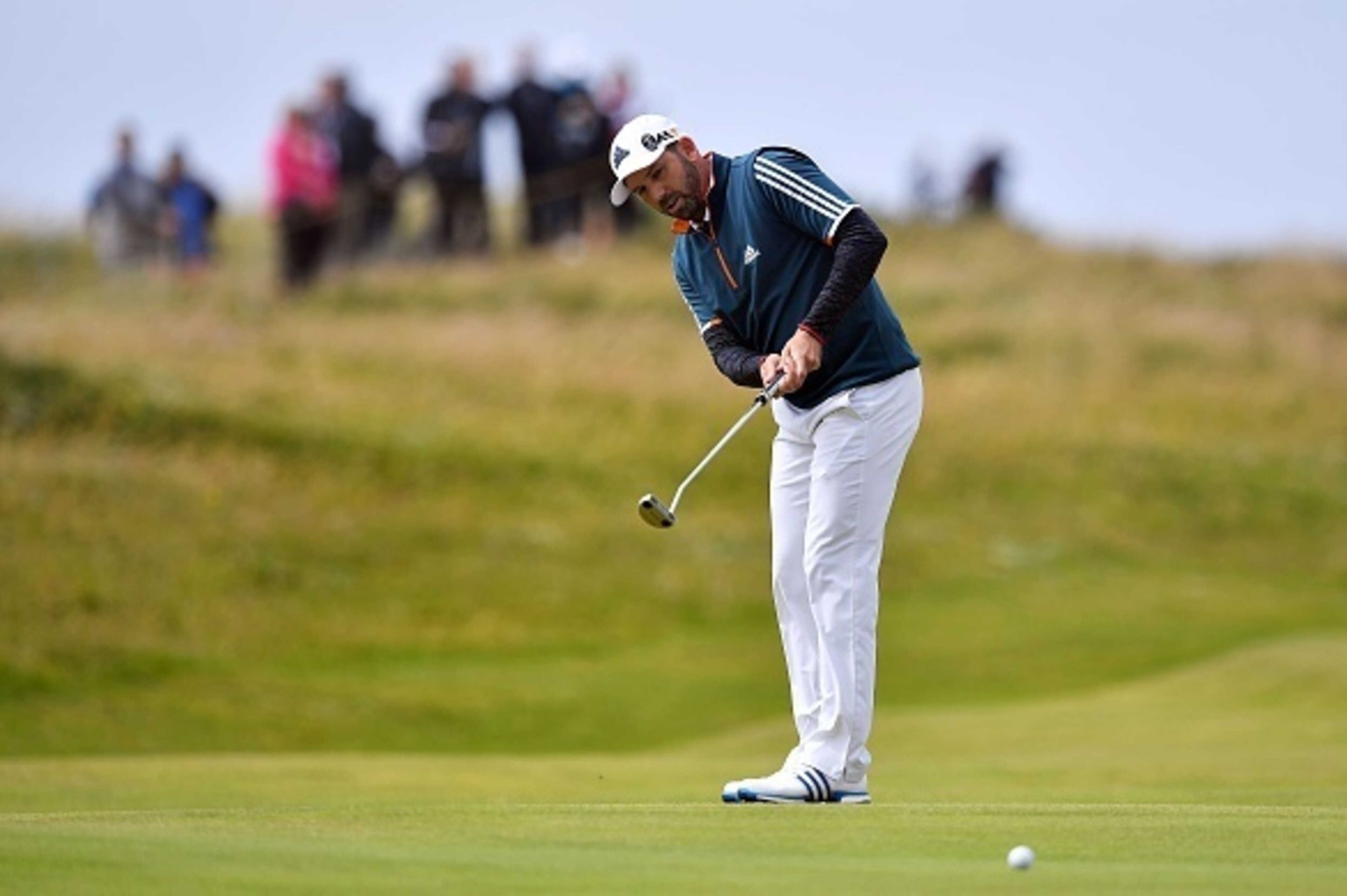 Spain's Sergio Garcia lines putts on the 4th green during his final round on day four of the 2016 British Open Golf Championship at Royal Troon in Scotland on July 17, 2016.
Troon has seen just about everything in terms of weather so far this week, with g