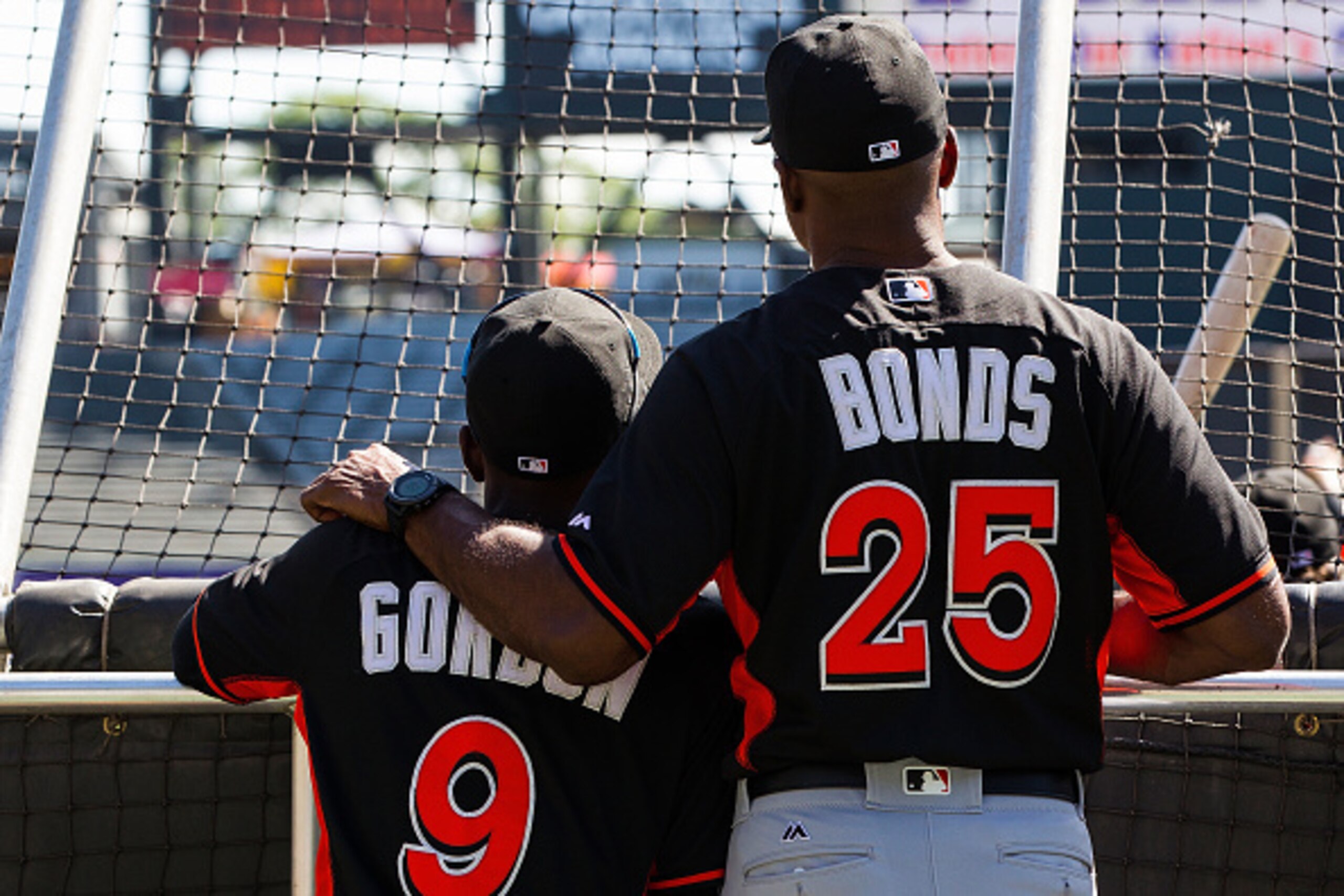 SAN FRANCISCO, CA - APRIL 24: Barry Bonds #25 of the Miami Marlins talks to Dee Gordon #9 during batting practice before the game against the San Francisco Giants at AT&T Park on April 24, 2016 in San Francisco, California.  The Miami Marlins defeated the
