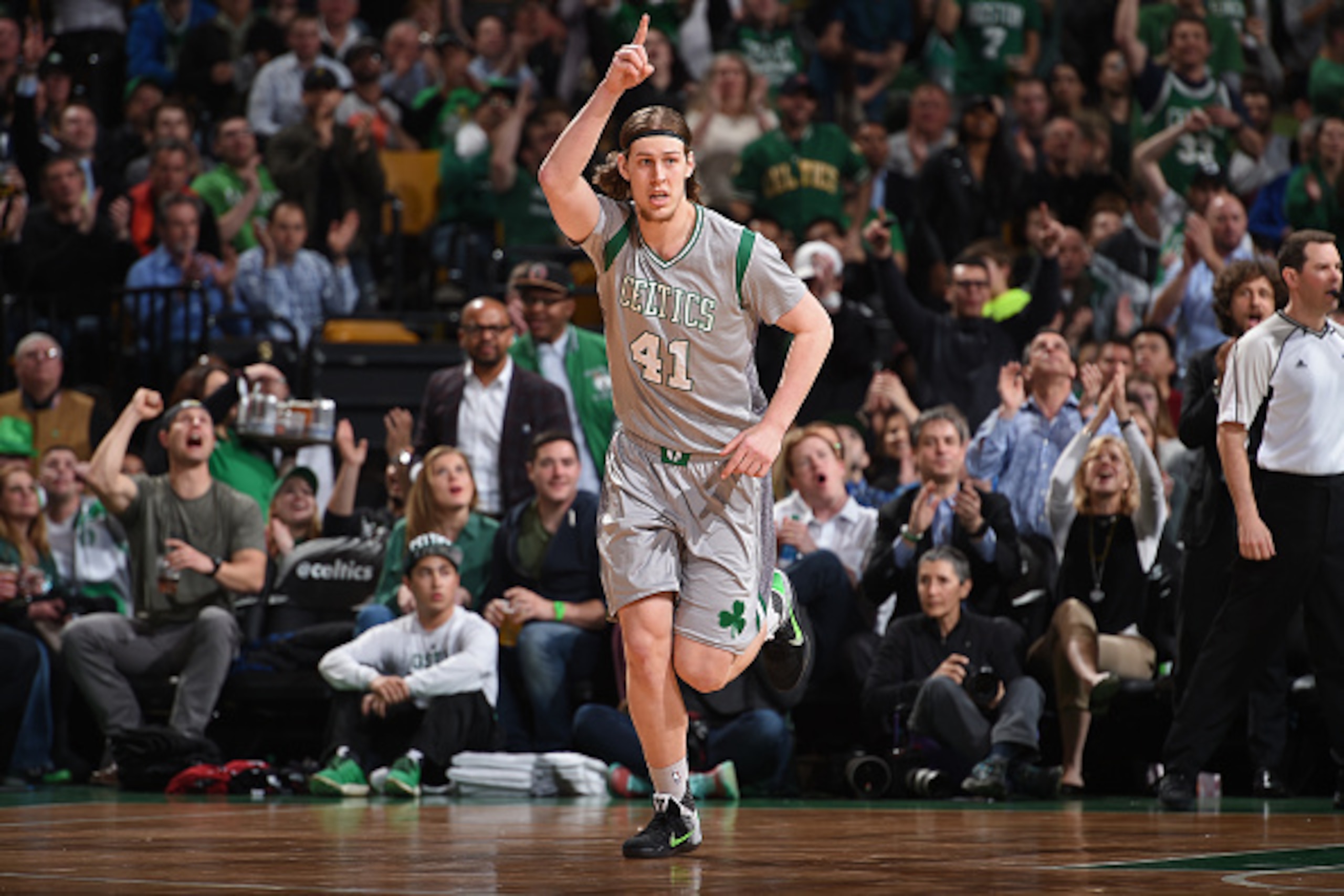 BOSTON, MA - APRIL 13:  Kelly Olynyk #41 of the Boston Celtics celebrates a three point basket as he runs up the court against the Miami Heat on April 13, 2016 at the TD Garden in Boston, Massachusetts.  NOTE TO USER: User expressly acknowledges and agree