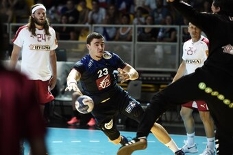 France's Ludovic Fabreguas (C) tries to score during the 'Eurotournoi' handball match France vs Denmark as part of the preparation for the 2016 Rio Olympic Games on July 24, 2016 in Strasbourg, eastern France. / AFP / FREDERICK FLORIN        (Photo credit