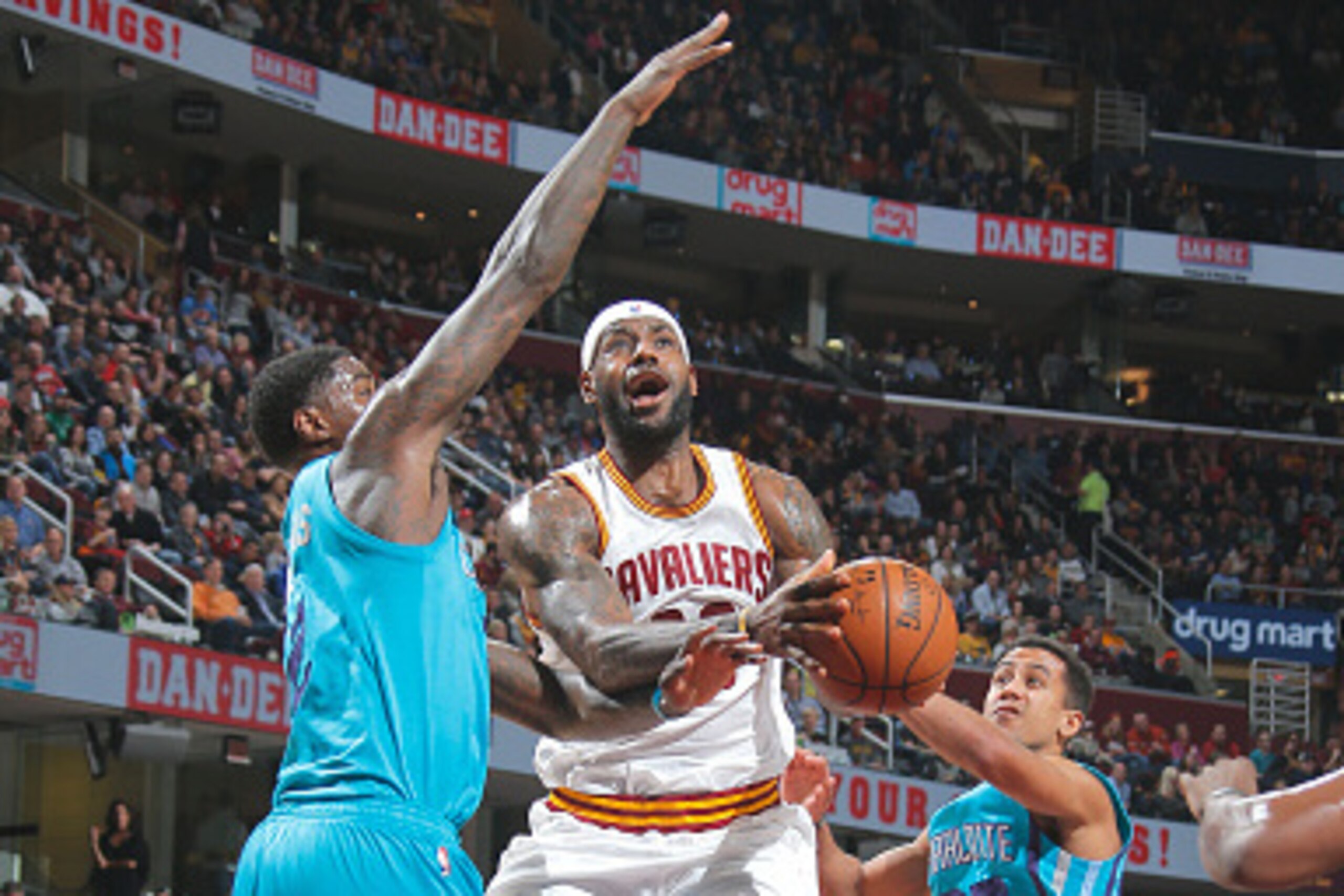 CLEVELAND, OH - JANUARY 23: LeBron James #23 of the Cleveland Cavaliers goes up for the shot against Marvin Williams #2 of the Charlotte Hornets on January 23, 2015 at Quicken Loans Arena in Cleveland, Ohio. NOTE TO USER: User expressly acknowledges and CLEVELAND, OH - JANUARY 23: LeBron James #23 of the Cleveland Cavaliers goes up for the shot against Marvin Williams #2 of the Charlotte Hornets on January 23, 2015 at Quicken Loans Arena in Cleveland, Ohio. NOTE TO USER: User expressly acknowledges and