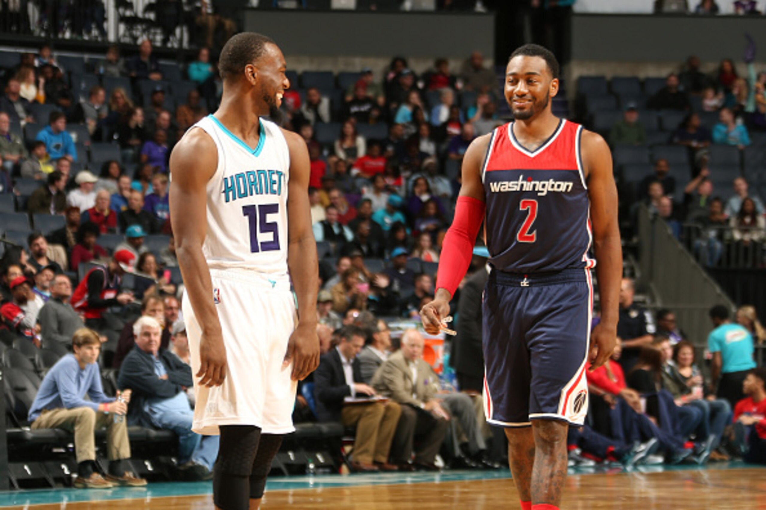 CHARLOTTE, NC - NOVEMBER 25: Kemba Walker #15 of the Charlotte Hornets and John Wall #2 of the Washington Wizards during the game on November 25, 2015 at Time Warner Cable Arena in Charlotte, North Carolina. NOTE TO USER: User expressly acknowledges and a CHARLOTTE, NC - NOVEMBER 25: Kemba Walker #15 of the Charlotte Hornets and John Wall #2 of the Washington Wizards during the game on November 25, 2015 at Time Warner Cable Arena in Charlotte, North Carolina. NOTE TO USER: User expressly acknowledges and a