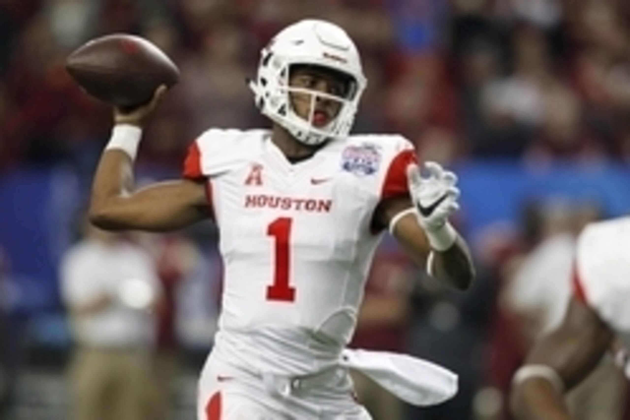 Dec 31, 2015; Atlanta, GA, USA; Houston Cougars quarterback Greg Ward Jr. (1) throws the ball against the Florida State Seminoles in the fourth quarter in the 2015 Chick-fil-A Peach Bowl at the Georgia Dome. The Cougars won 38-24. Mandatory Credit: Brett