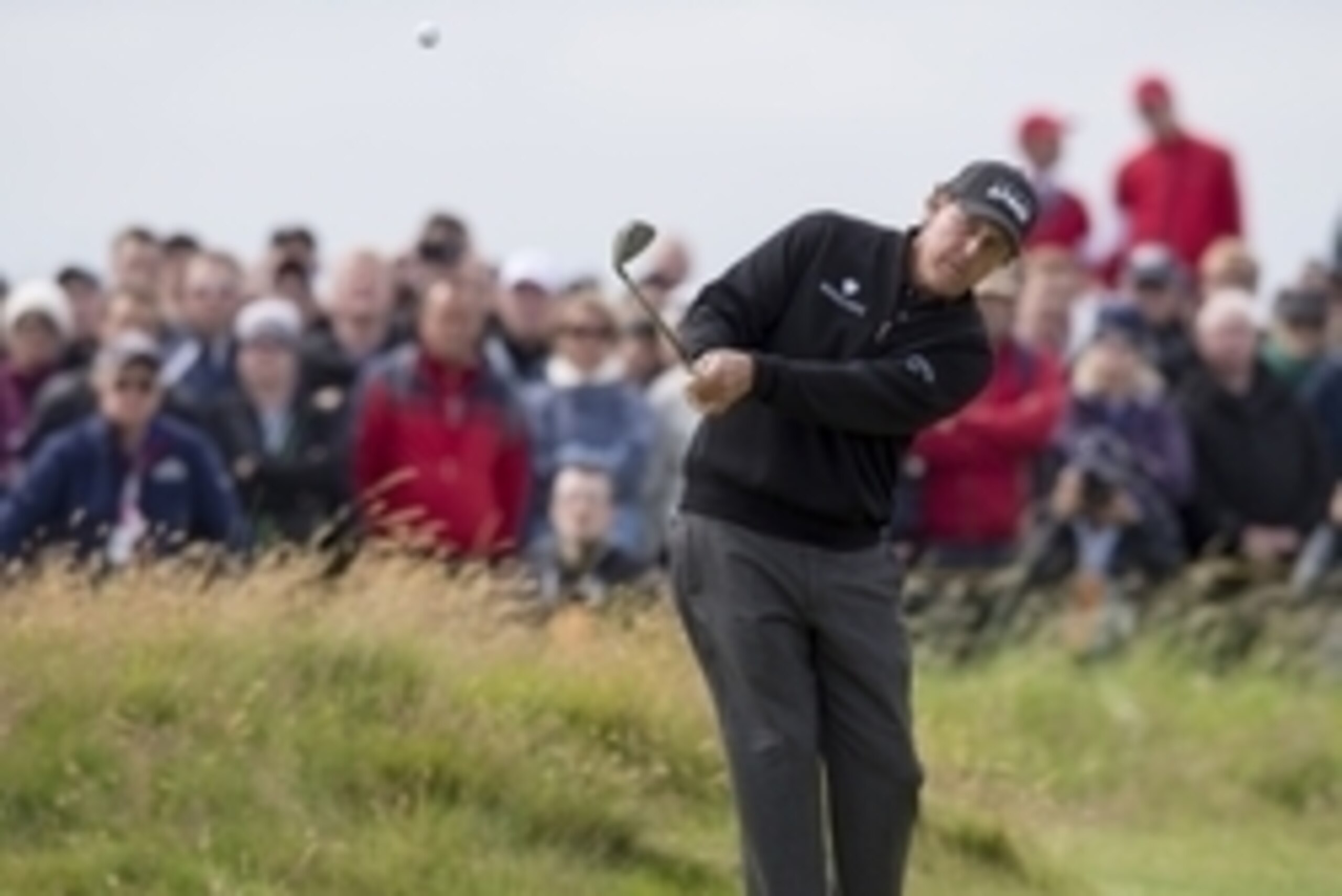Jul 17, 2016; Troon, Ayrshire,  SCT; Phil Mickelson (USA) watches his chip shot on the 3rd hole during the final round of the 145th Open Championship golf tournament at Royal Troon Golf Club - Old Course. Mandatory Credit: Ian Rutherford-USA TODAY Sports