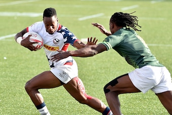 LAS VEGAS, NV - MARCH 06:  Carlin Isles (L) of the United States holds offs Seabelo Senatla of South Africa during the USA Sevens Rugby tournament at Sam Boyd Stadium on March 6, 2016 in Las Vegas, Nevada. South africa won 21-10. (Photo by David Becker/Ge