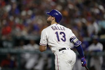 ARLINGTON, TX - JULY 26:  Joey Gallo #13 of the Texas Rangers hits a homerun against the Oakland Athletics in the fifth inning at Globe Life Park in Arlington on July 26, 2016 in Arlington, Texas.  (Photo by Ronald Martinez/Getty Images)