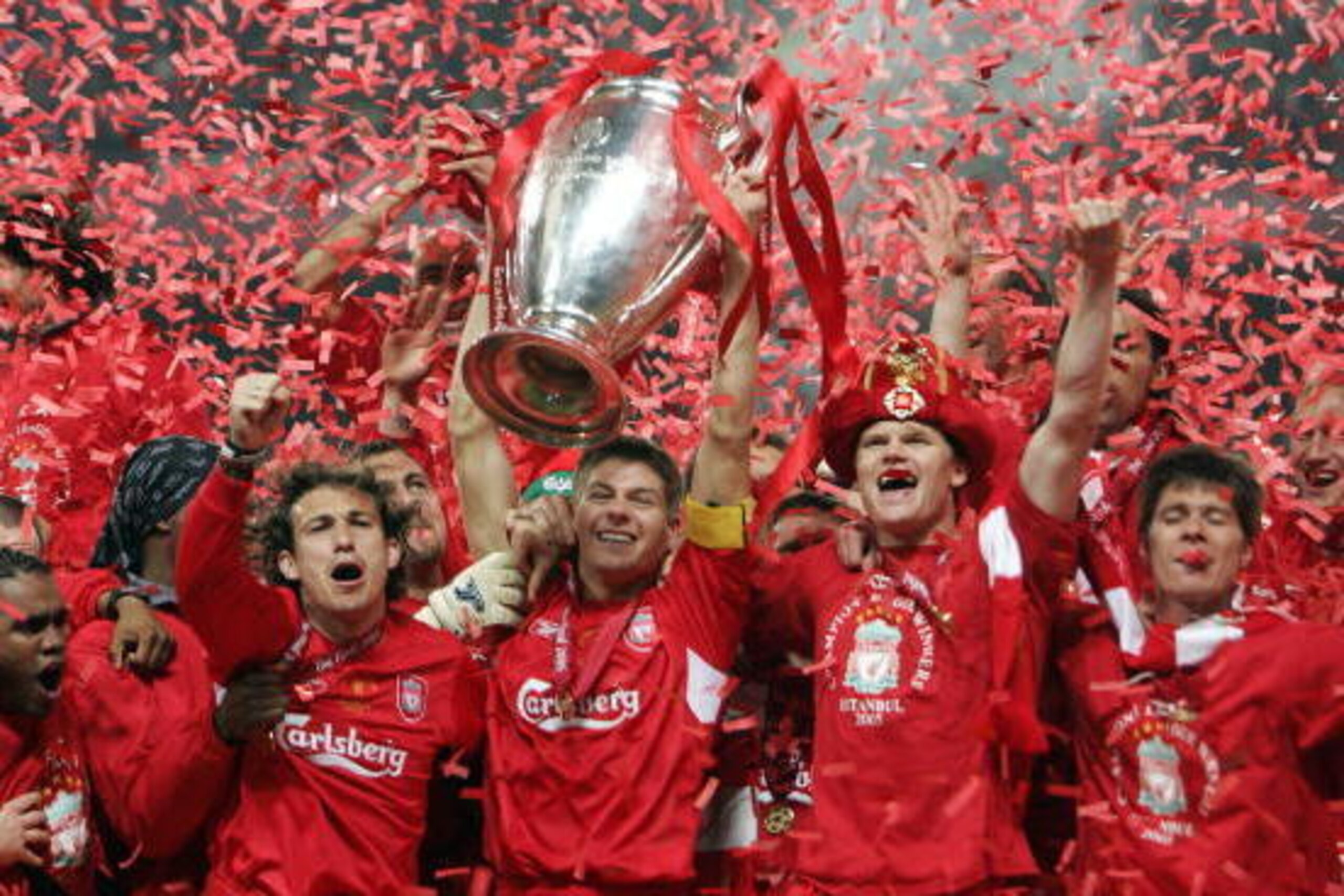 Istanbul, Turkey:  Liverpool's captain Steven Gerrard holds the throphy surrounded by teammates at the end of the UEFA Champions league football final AC Milan vs Liverpool, 25 May 2005 at the Ataturk Stadium in Istanbul.  Liverpool won 3-2 on penalties. 