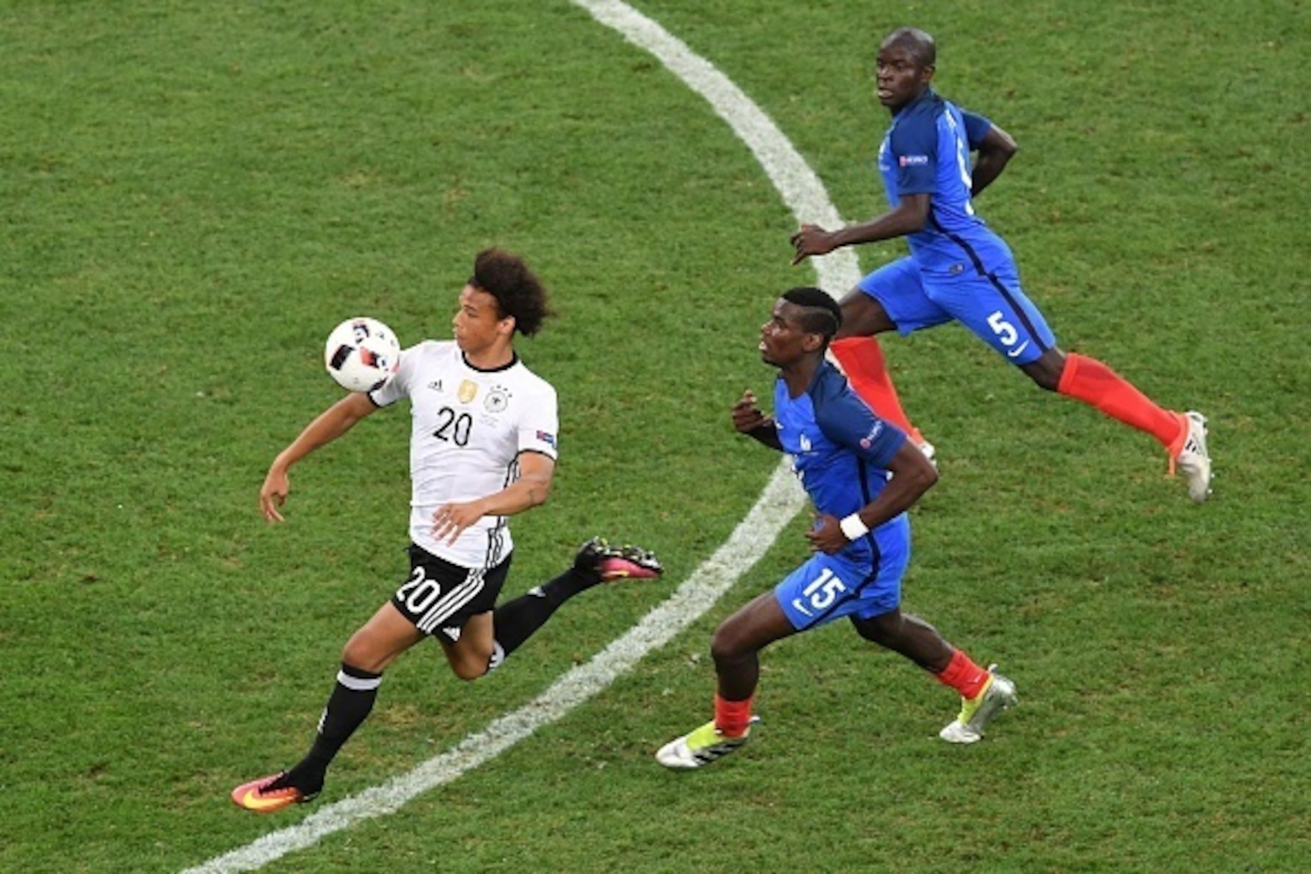 Germany's midfielder Leroy Sane (L) vies for the ball with France's midfielder Paul Pogba (C) and France's midfielder N'Golo Kante during the Euro 2016 semi-final football match between Germany and France at the Stade Velodrome in Marseille on July 7, 201