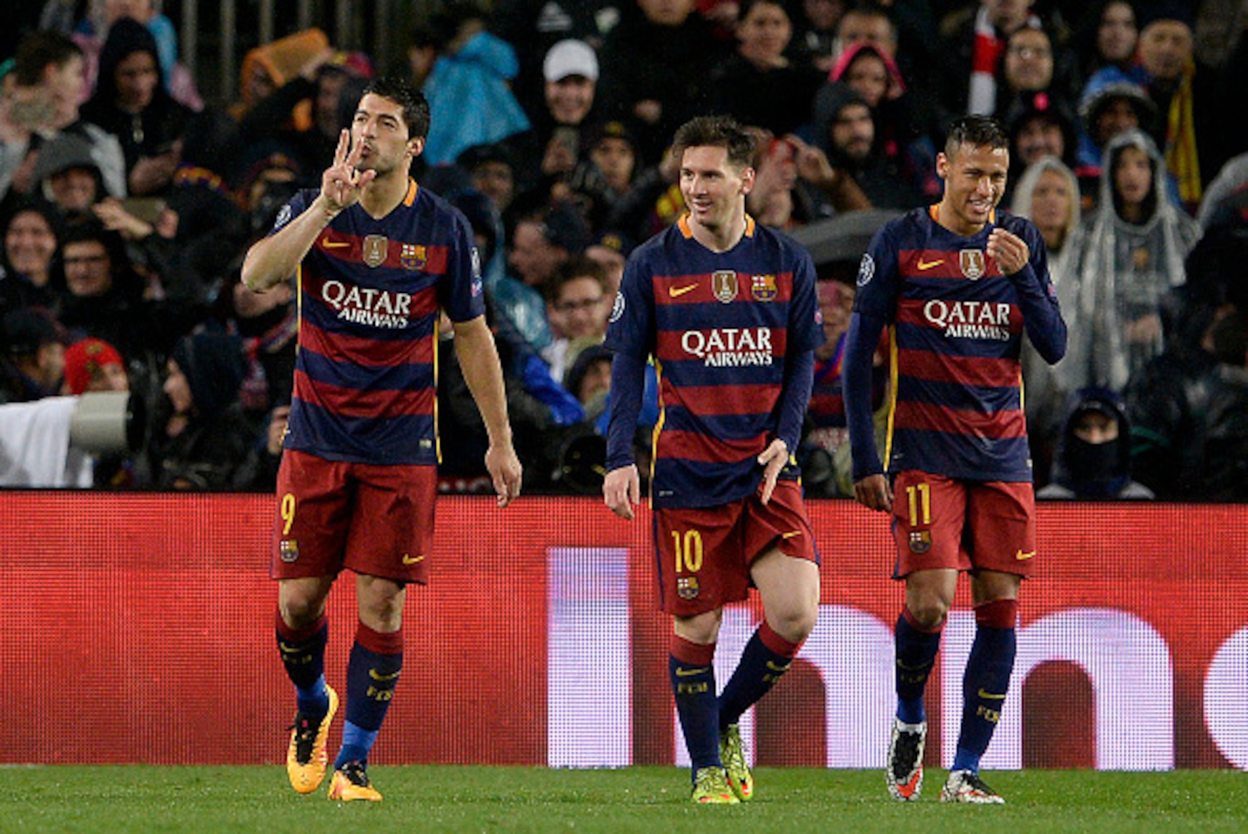 Barcelona's Uruguayan forward Luis Suarez (L) celebrates his goal with Barcelona's Argentinian forward Lionel Messi (C) and Barcelona's Brazilian forward Neymar (R) during the UEFA Champions League Round of 16 second leg football match FC Barcelona vs Ars