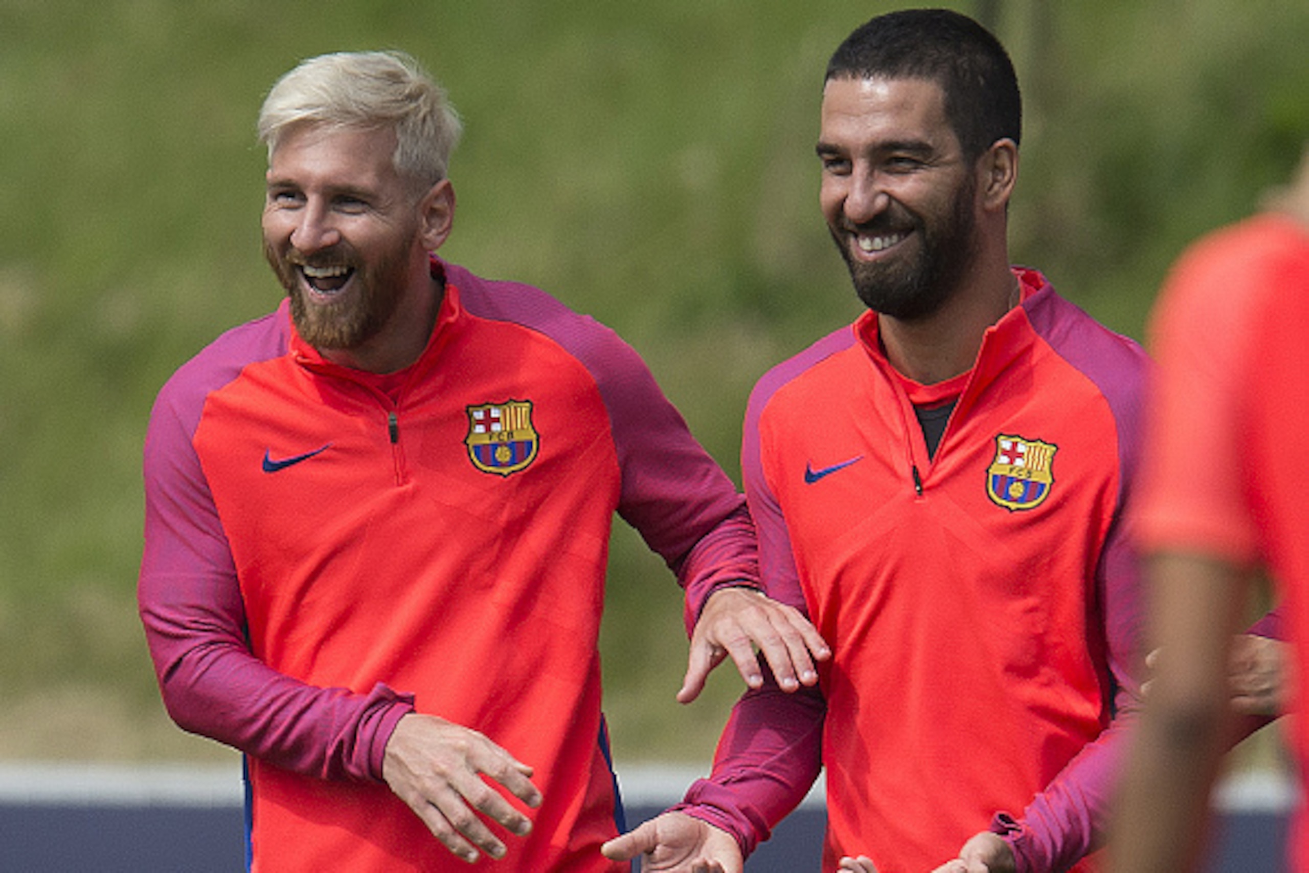 Barcelona's Argentinian forward Lionel Messi (L) and Barcelona's Turkish midfielder Arda Turan take part in a team training session at St George's Park near Burton-on-Trent, central England, on July 27, 2016.
Barcelona are taking part in a five-day traini