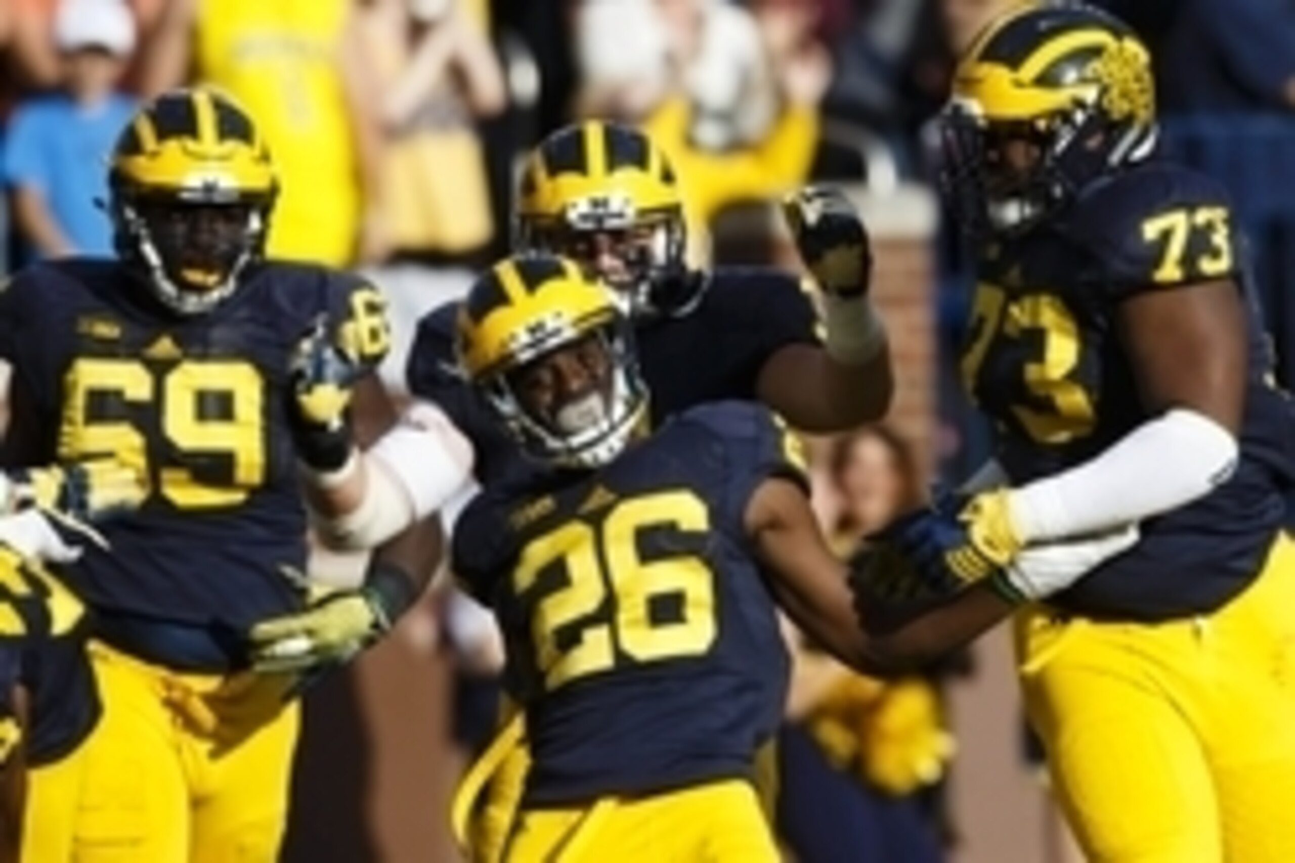 Oct 10, 2015; Ann Arbor, MI, USA; Michigan Wolverines cornerback Jourdan Lewis (26) celebrates with teammates after he scores a touchdown on an interception in the second quarter against the Northwestern Wildcats at Michigan Stadium. Mandatory Credit: Ric