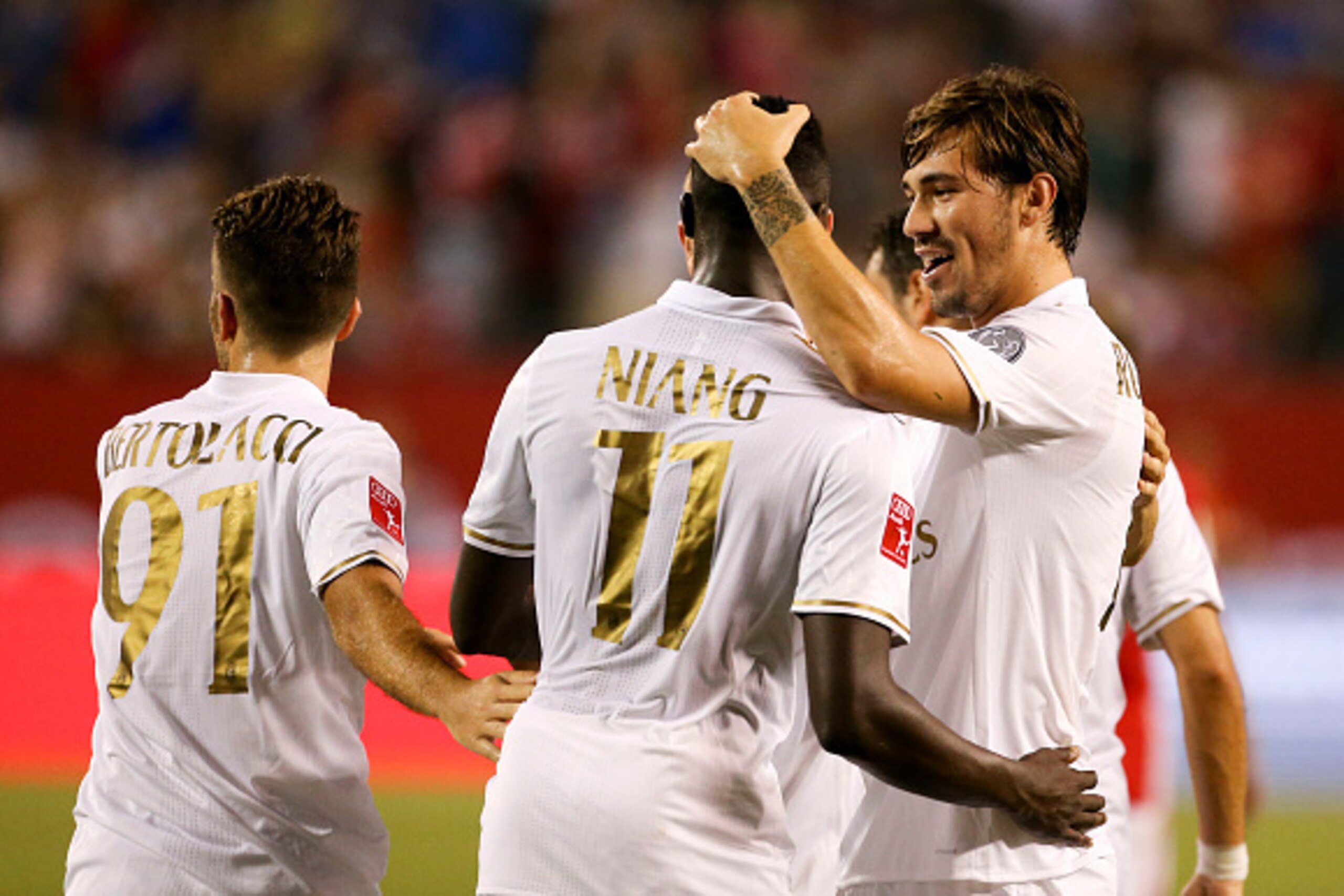 Alessio Cerci #11 celebrates his goal with Alessio Romagnoli #13 AC Milan against FC Bayern Munich at the International Champions Cup on July 27, 2016 at Solider Field Stadium in Chicago, Illinois.  / AFP / Tasos Katopodis        (Photo credit should read