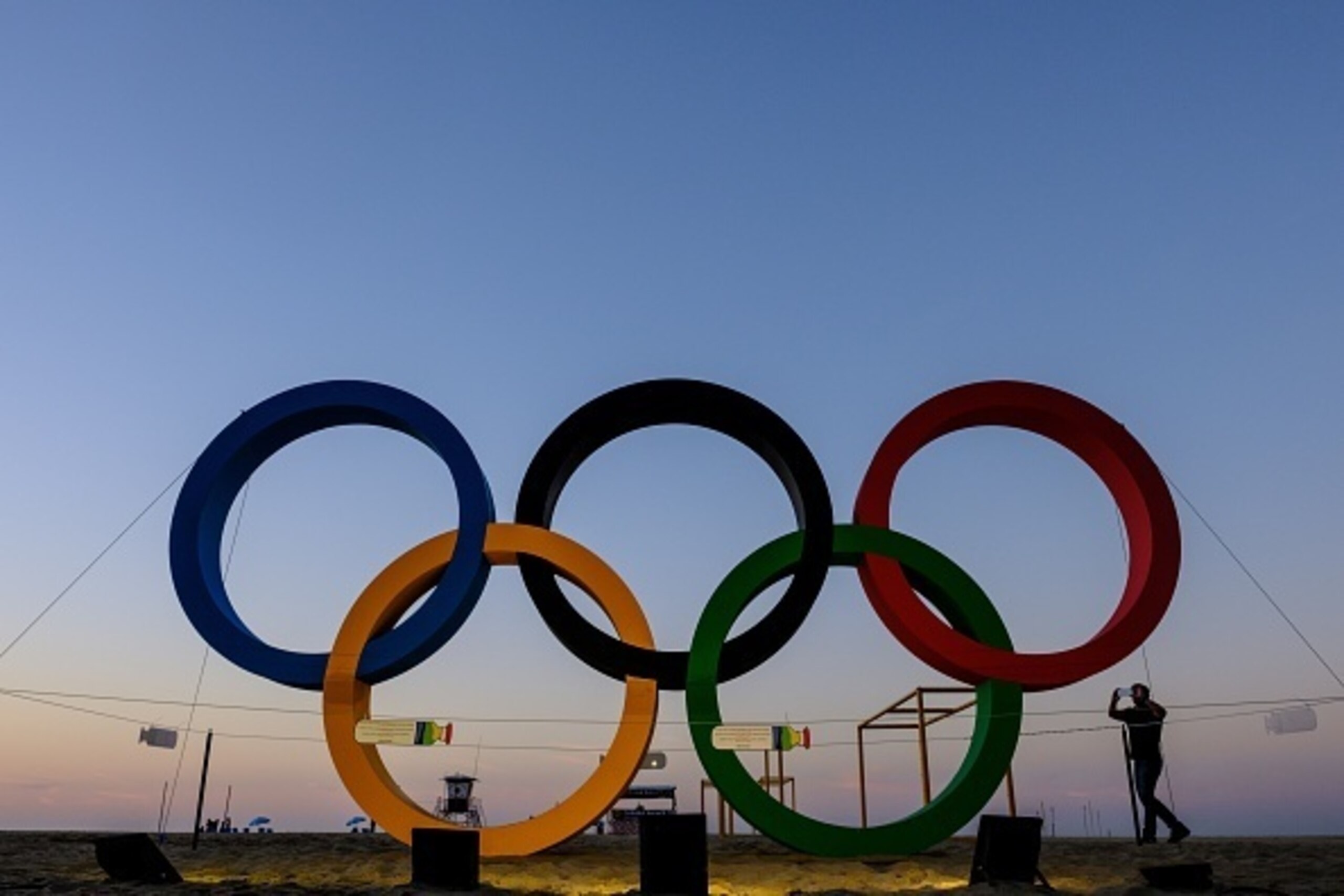 Olympic rings made of recycled materials are illuminated in the early morning at Copacabana beach in Rio de Janeiro, Brazil, on July 24, 2016.
The Rio 2016 Olympic and Paralympic Games will be held in Brazil from August 5-21 and September 7-18 respectivel