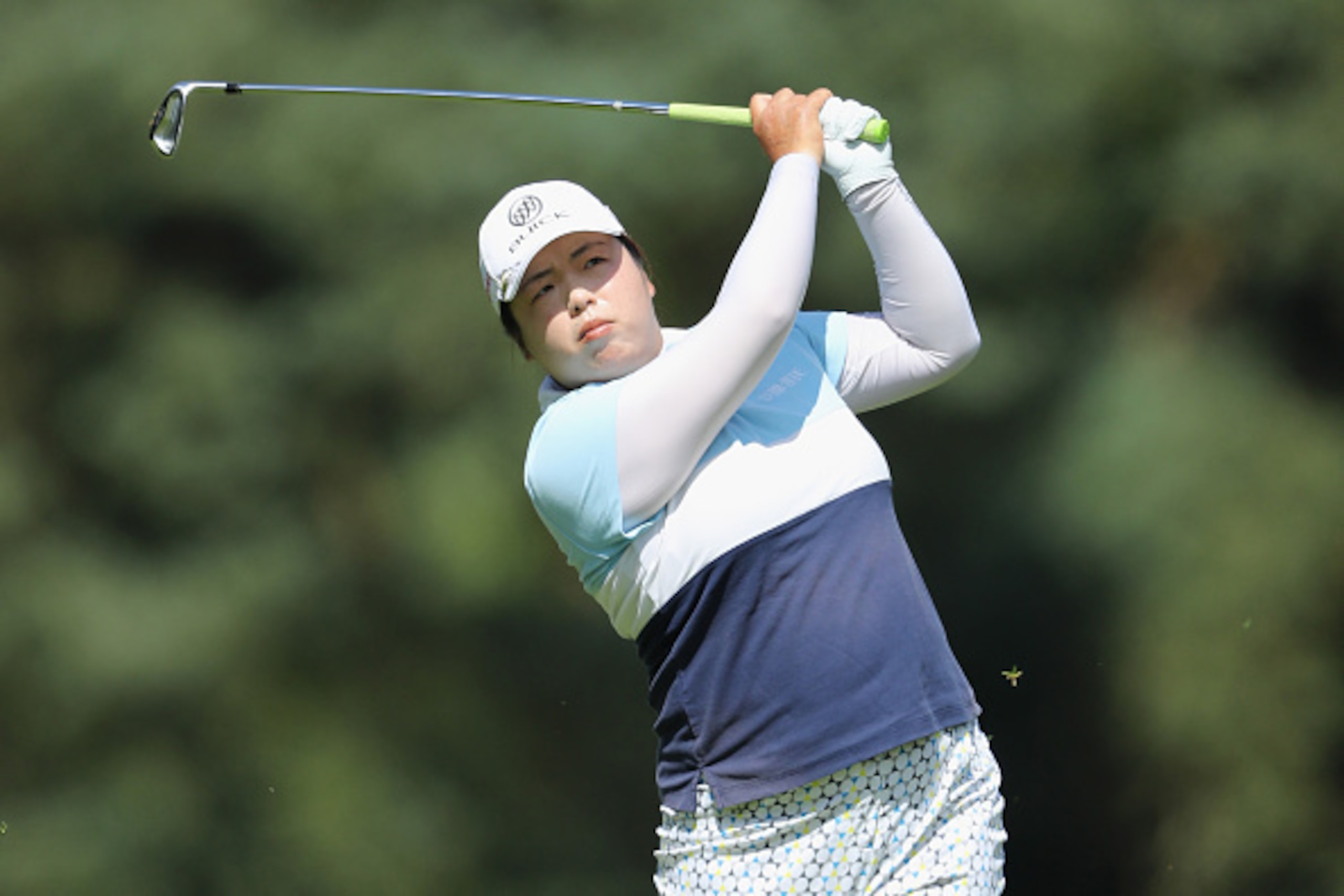 WOBURN, UNITED KINGDOM - JULY 28:  Shanshan Feng of China hits her second shot on the 1st hole during the first round of the 2016 Ricoh Women's British Open on July 28, 2016 in Woburn, England.  (Photo by David Cannon/Getty Images)
