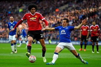 LONDON, ENGLAND - APRIL 23: Leighton Baines of Everton is closed down by Marouane Fellaini of Manchester United  during The Emirates FA Cup semi final match between Everton and Manchester United at Wembley Stadium on April 23, 2016 in London, England.  (P