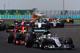 BUDAPEST, HUNGARY - JULY 24: Lewis Hamilton of Great Britain driving the (44) Mercedes AMG Petronas F1 Team Mercedes F1 WO7 Mercedes PU106C Hybrid turbo leads Daniel Ricciardo of Australia driving the (3) Red Bull Racing Red Bull-TAG Heuer RB12 TAG Heuer 