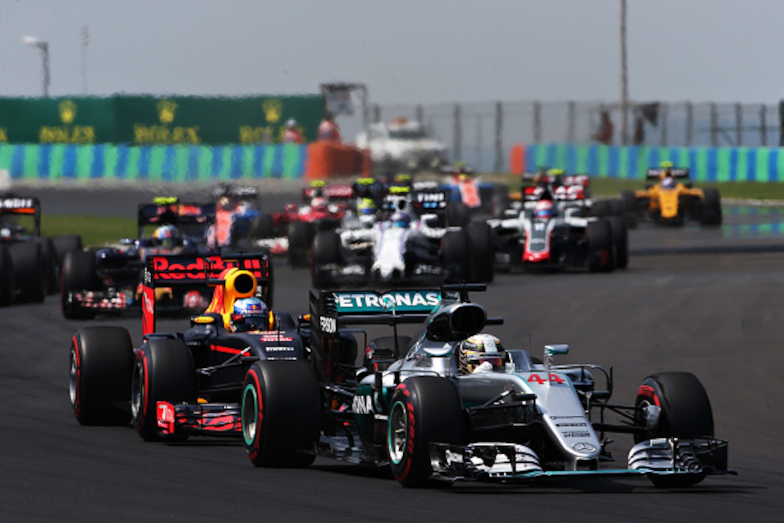 BUDAPEST, HUNGARY - JULY 24: Lewis Hamilton of Great Britain driving the (44) Mercedes AMG Petronas F1 Team Mercedes F1 WO7 Mercedes PU106C Hybrid turbo leads Daniel Ricciardo of Australia driving the (3) Red Bull Racing Red Bull-TAG Heuer RB12 TAG Heuer 