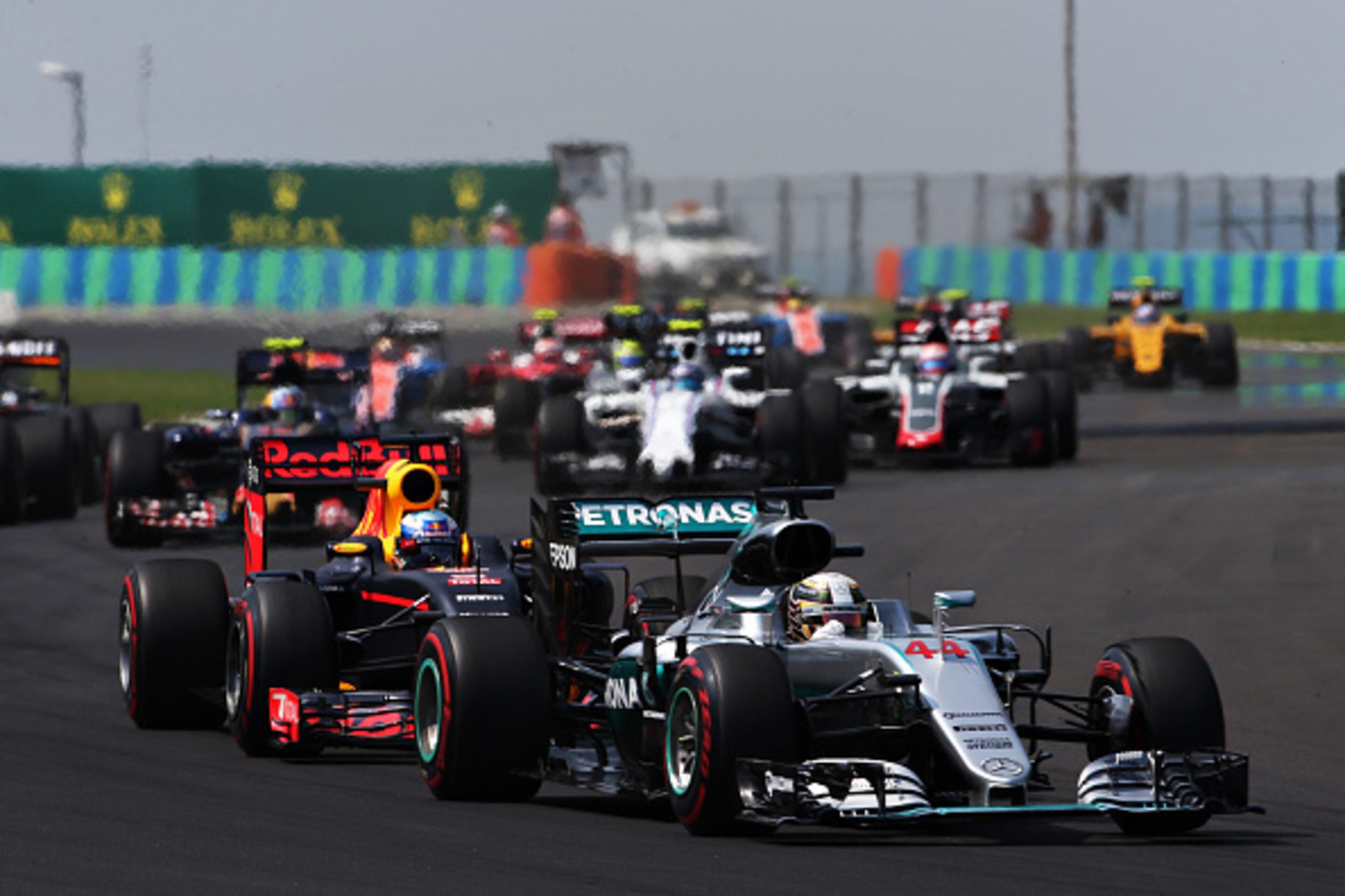 BUDAPEST, HUNGARY - JULY 24: Lewis Hamilton of Great Britain driving the (44) Mercedes AMG Petronas F1 Team Mercedes F1 WO7 Mercedes PU106C Hybrid turbo leads Daniel Ricciardo of Australia driving the (3) Red Bull Racing Red Bull-TAG Heuer RB12 TAG Heuer 