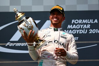 BUDAPEST, HUNGARY - JULY 24:  Lewis Hamilton of Greatc Britain and Mercedes GP lifts the trophy on the podium after winning the Formula One Grand Prix of Hungary at Hungaroring on July 24, 2016 in Budapest, Hungary.  (Photo by Dan Istitene/Getty Images)