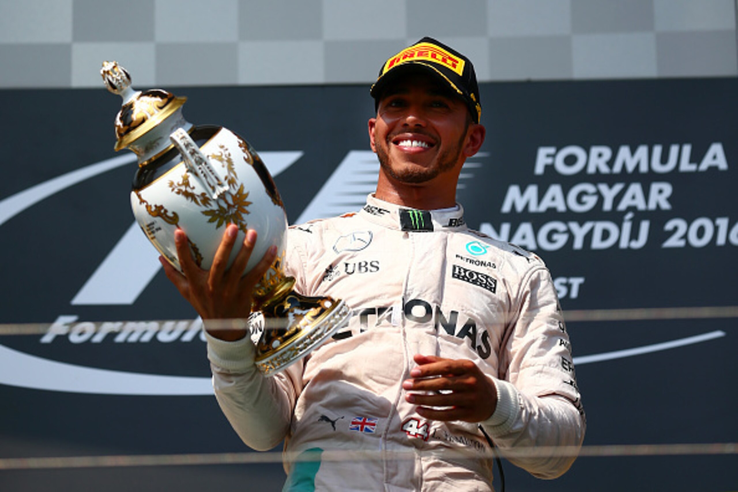 BUDAPEST, HUNGARY - JULY 24:  Lewis Hamilton of Greatc Britain and Mercedes GP lifts the trophy on the podium after winning the Formula One Grand Prix of Hungary at Hungaroring on July 24, 2016 in Budapest, Hungary.  (Photo by Dan Istitene/Getty Images)