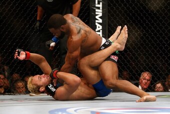 LAS VEGAS, NV - NOVEMBER 16:  Tyron Woodley (top) punches Josh Koscheck in their welterweight bout during the UFC 167 event inside the MGM Grand Garden Arena on November 16, 2013 in Las Vegas, Nevada. (Photo by Donald Miralle/Zuffa LLC/Zuffa LLC via Getty