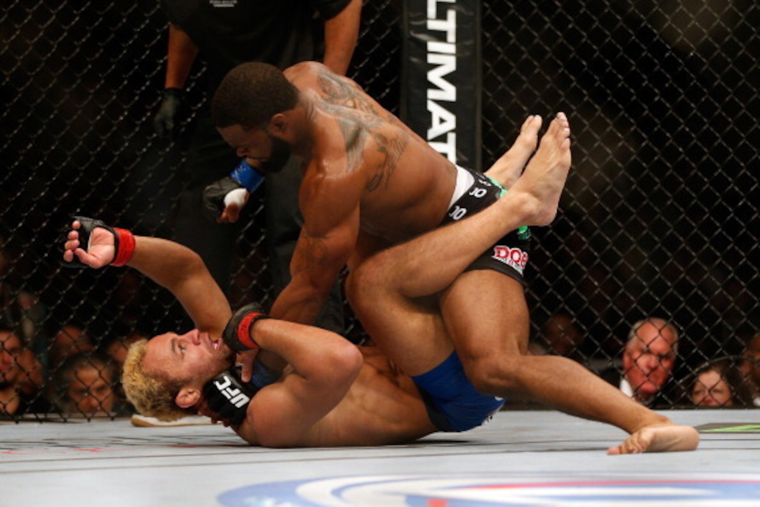 LAS VEGAS, NV - NOVEMBER 16:  Tyron Woodley (top) punches Josh Koscheck in their welterweight bout during the UFC 167 event inside the MGM Grand Garden Arena on November 16, 2013 in Las Vegas, Nevada. (Photo by Donald Miralle/Zuffa LLC/Zuffa LLC via Getty