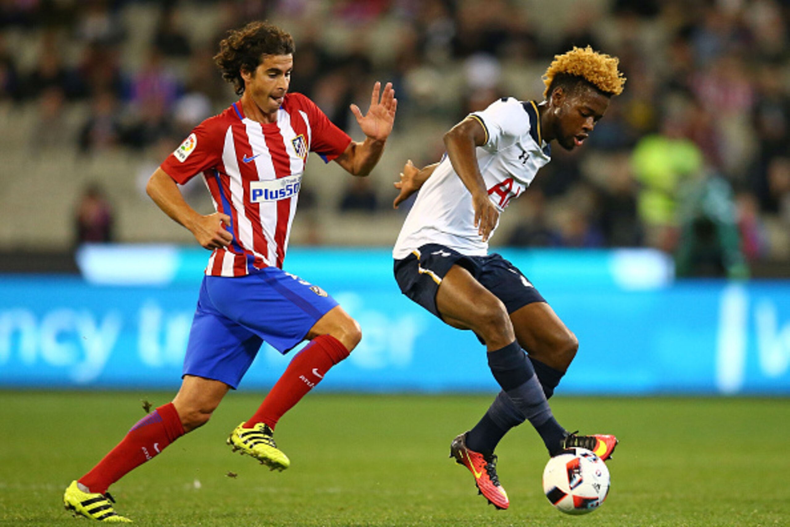 MELBOURNE, AUSTRALIA - JULY 29:  Josh Onomah of Tottenham Hotspur and Tiago of Atletico de Madrid compete for the ball during 2016 International Champions Cup Australia match between Tottenham Hotspur and Atletico de Madrid at the Melbourne Cricket Ground