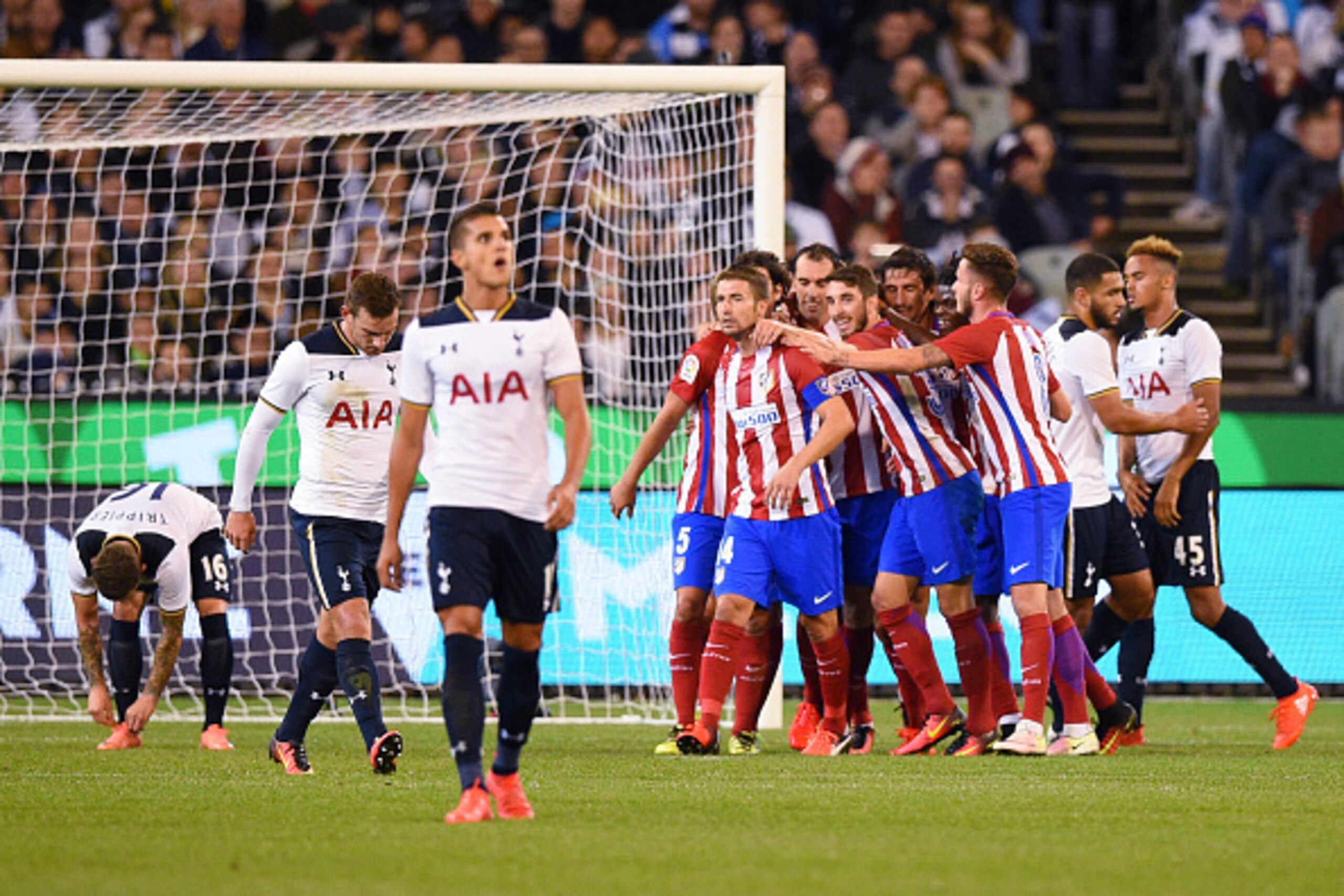 MELBOURNE, AUSTRALIA - JULY 29:  Atletico de Madrid players celebrate the goal of Diego Godin during 2016 International Champions Cup Australia match between Tottenham Hotspur and Atletico de Madrid at Melbourne Cricket Ground on July 29, 2016 in Melbourn