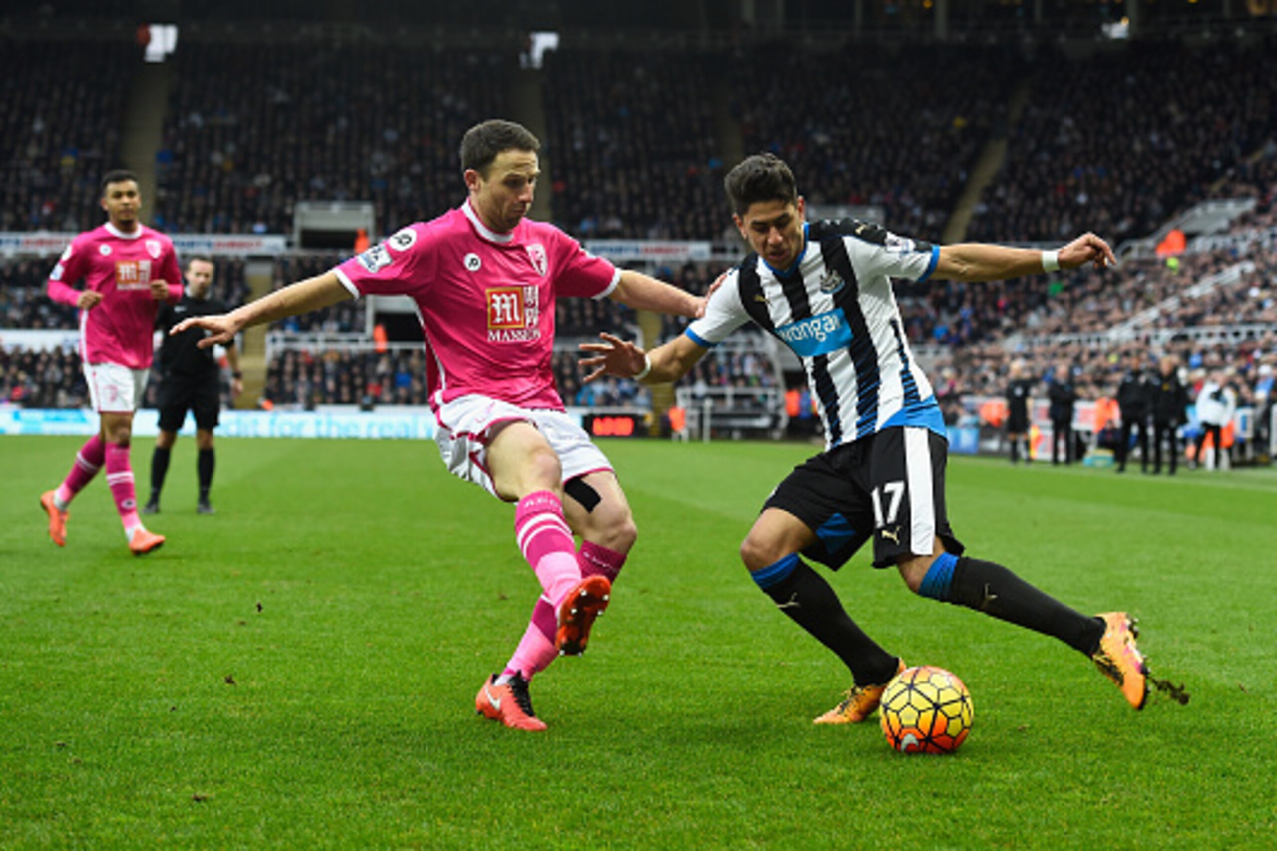 NEWCASTLE UPON TYNE, ENGLAND - MARCH 05:  Newcastle player Ayoze Perez (r) is challenged by Marc Pugh during the Barclays Premier League match between Newcastle United at A.F.C. Bournemouth at St James' Park on March 5 in Newcastle upon Tyne, England.  (P