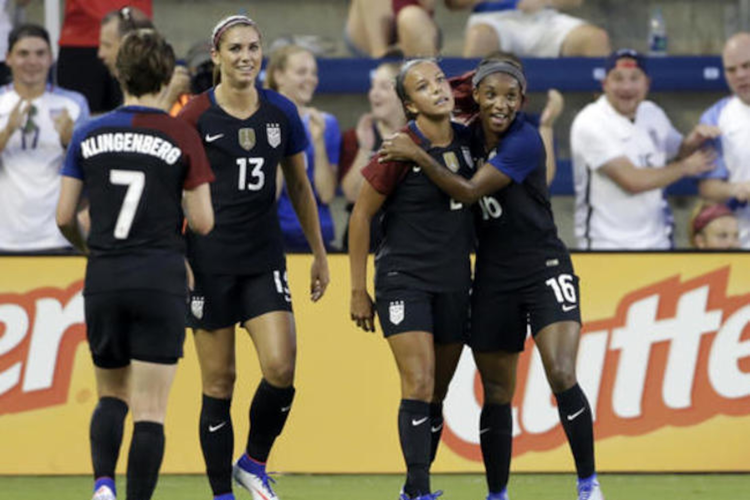 Pugh, 18, celebrates a goal against Costa Rica with her team-mates.