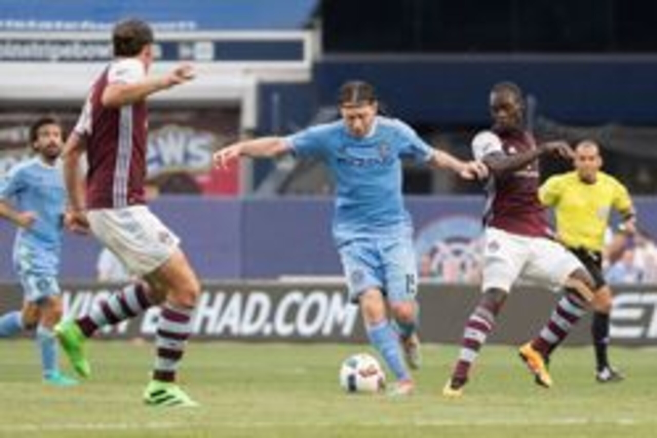 Jul 30, 2016; New York, NY, USA; New York City FC midfielder Thomas McNamara (15) controls the ball in front of Colorado Rapids midfielder Michael Azira (22) during the first half at Yankee Stadium. Mandatory Credit: Vincent Carchietta-USA TODAY Sports