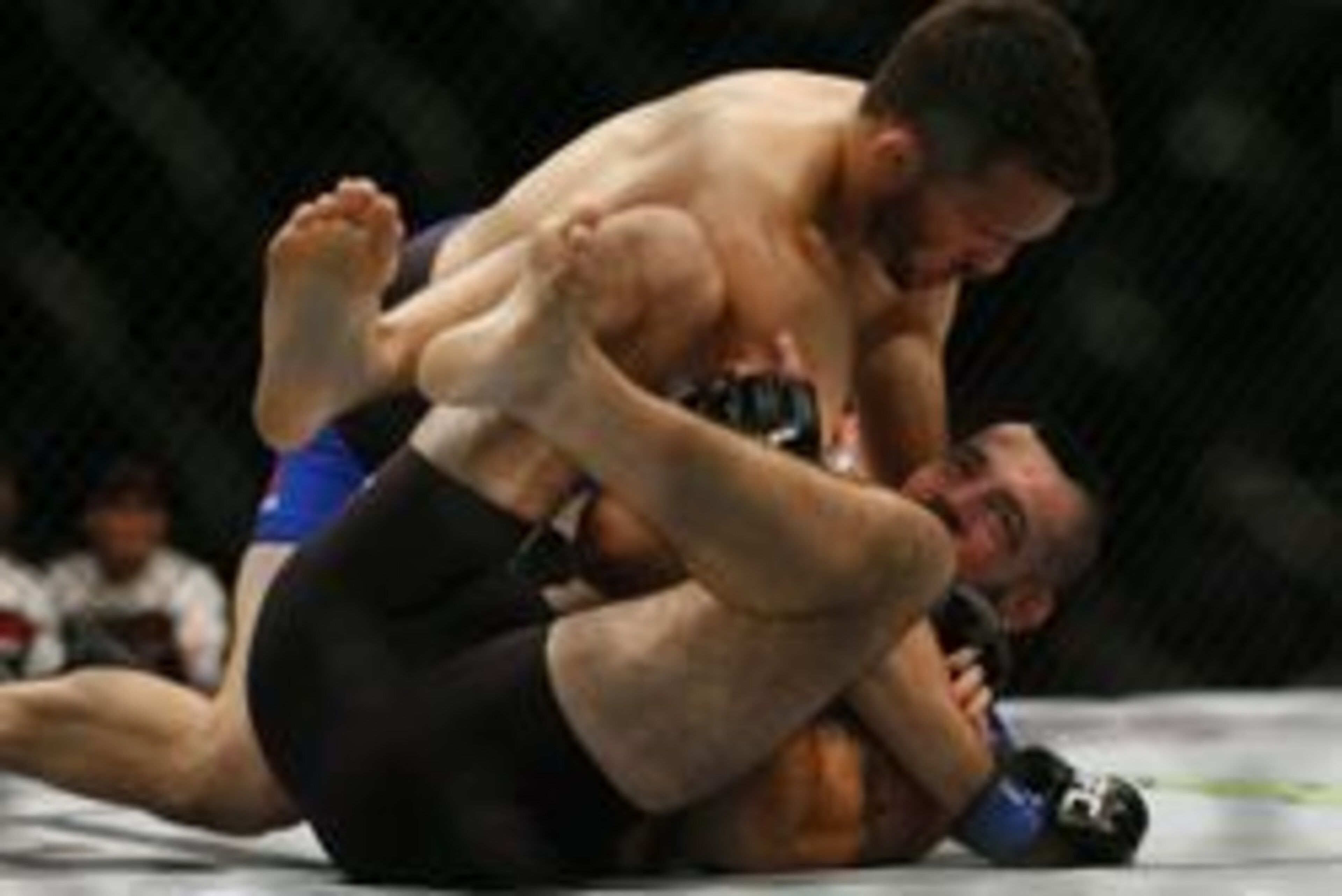 Jul 30, 2016; Atlanta, GA, USA; Matt Brown (red gloves) competes against Jake Ellenberger (blue gloves) during UFC 201 at Phillips Arena. Mandatory Credit: Butch Dill-USA TODAY Sports