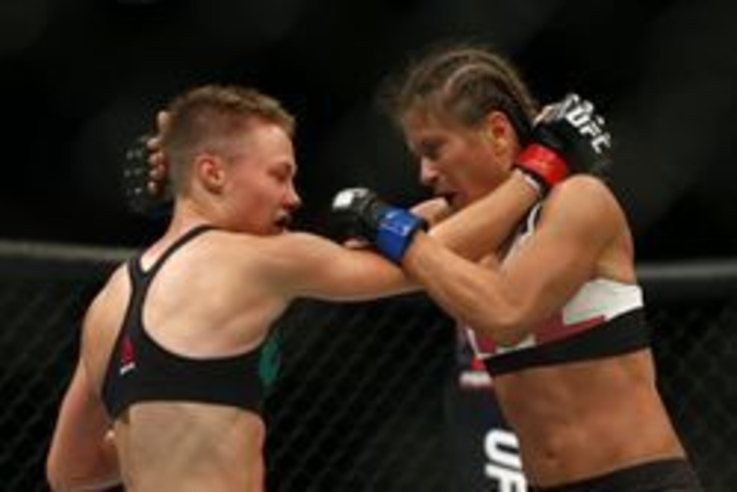 Jul 30, 2016; Atlanta, GA, USA; Rose Namajunas (red gloves) competes against Karolina Kowaliewicz (blue gloves) during UFC 201 at Phillips Arena. Mandatory Credit: Butch Dill-USA TODAY Sports