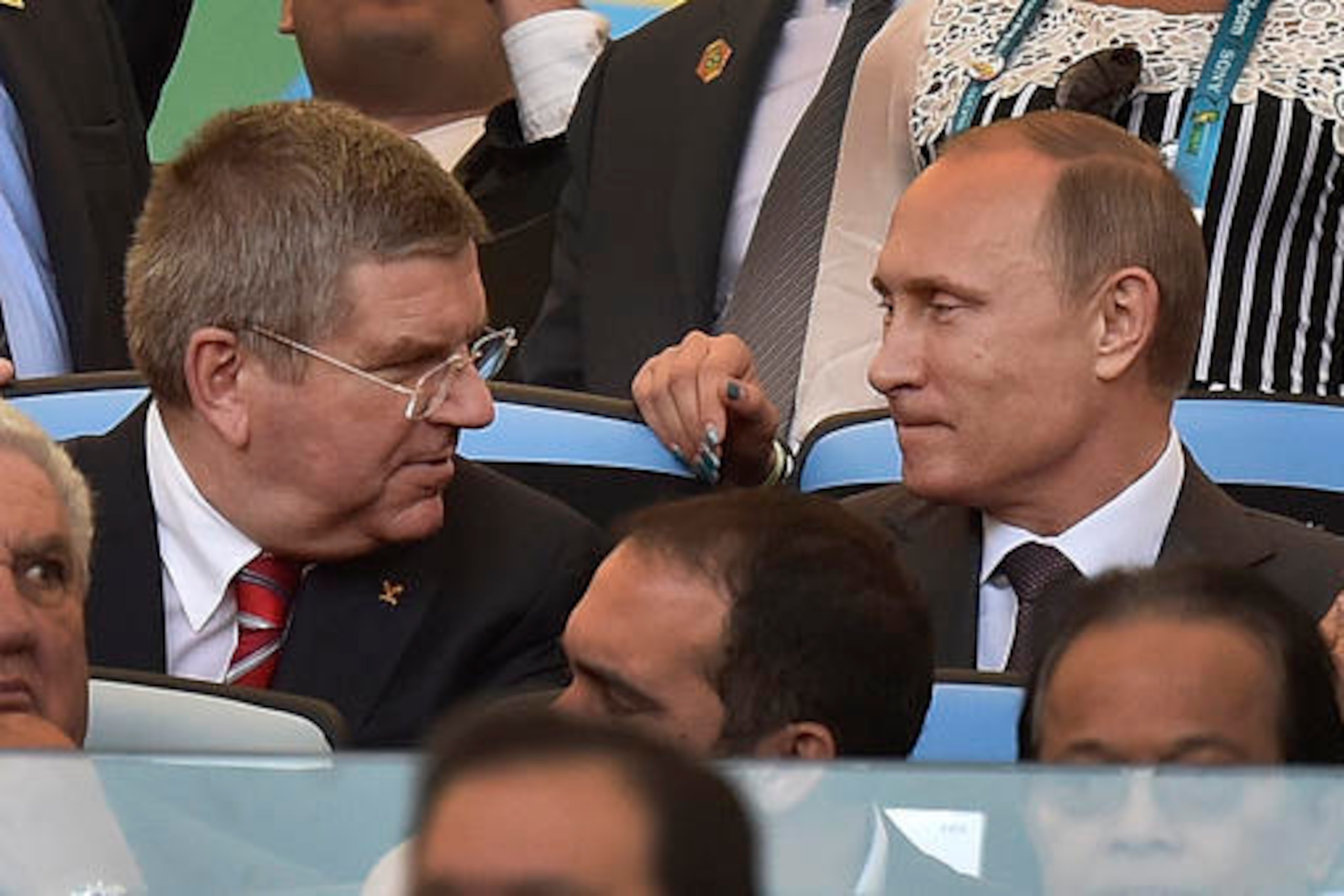 IOC President Thomas Bach, left, didn't discipline Vladimir Putin's Russian team for drug cheating as harshly as some expected.