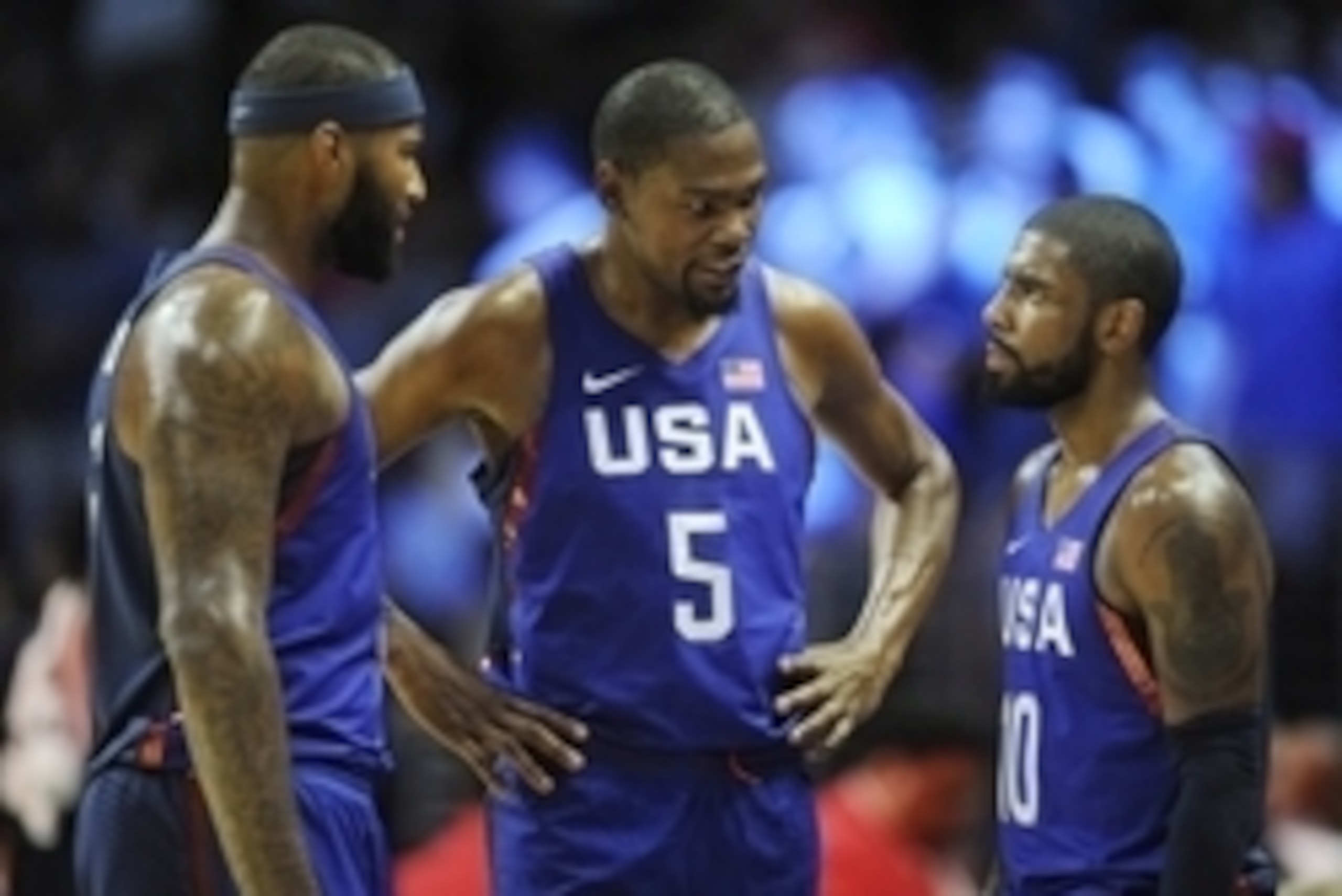 July 24, 2016; Los Angeles, CA, USA; USA guard Kevin Durant (5) speaks with center DeMarcus Cousins (left) and guard Kyrie Irving (right) before game action against China in the first half during an exhibition basketball game at Staples Center. Mandatory 