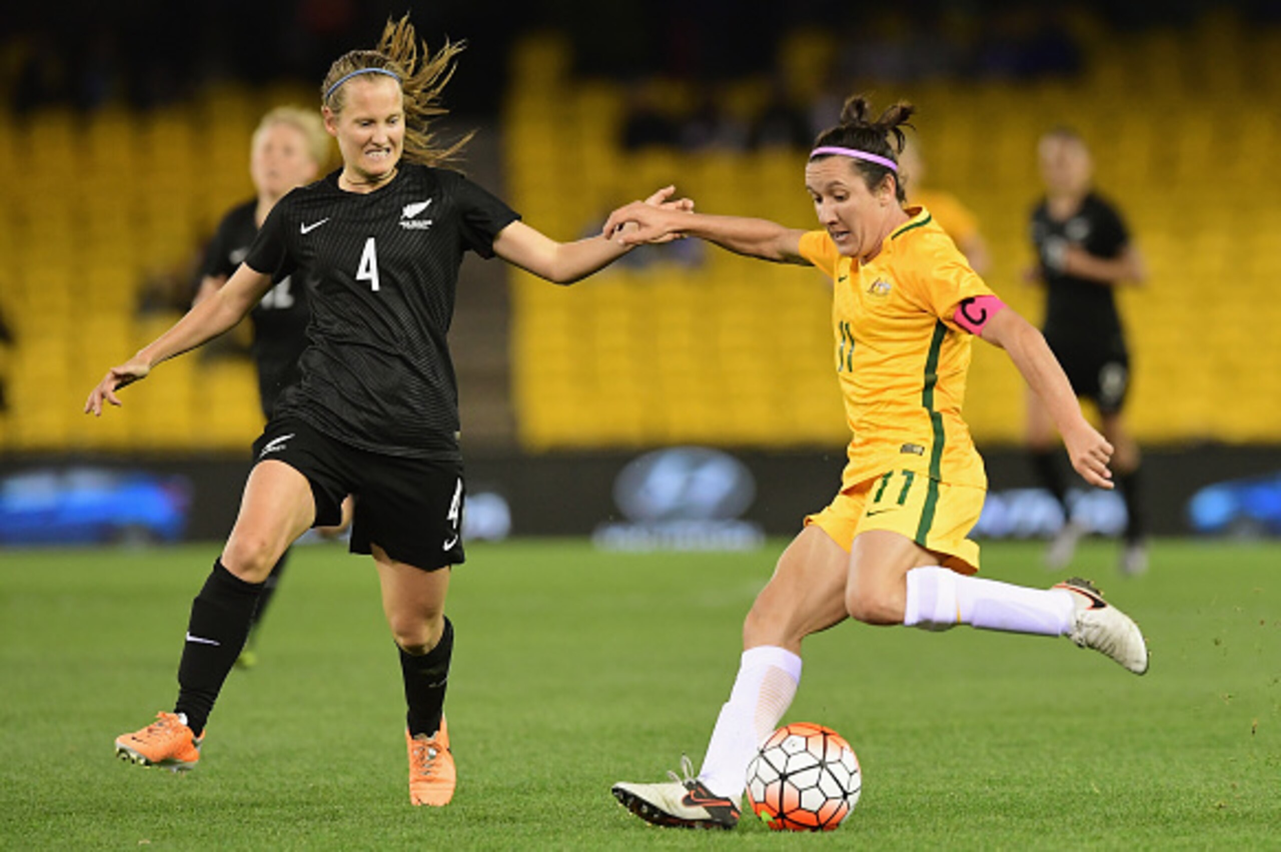 MELBOURNE, AUSTRALIA - JUNE 07: Lisa De Vanna of Australia passes infront of Katie Duncan of New Zealand during the Women's International Friendly match between the Australia Matildas and the New Zealand Football Ferns at Etihad Stadium on June 7, 2016 MELBOURNE, AUSTRALIA - JUNE 07: Lisa De Vanna of Australia passes infront of Katie Duncan of New Zealand during the Women's International Friendly match between the Australia Matildas and the New Zealand Football Ferns at Etihad Stadium on June 7, 2016