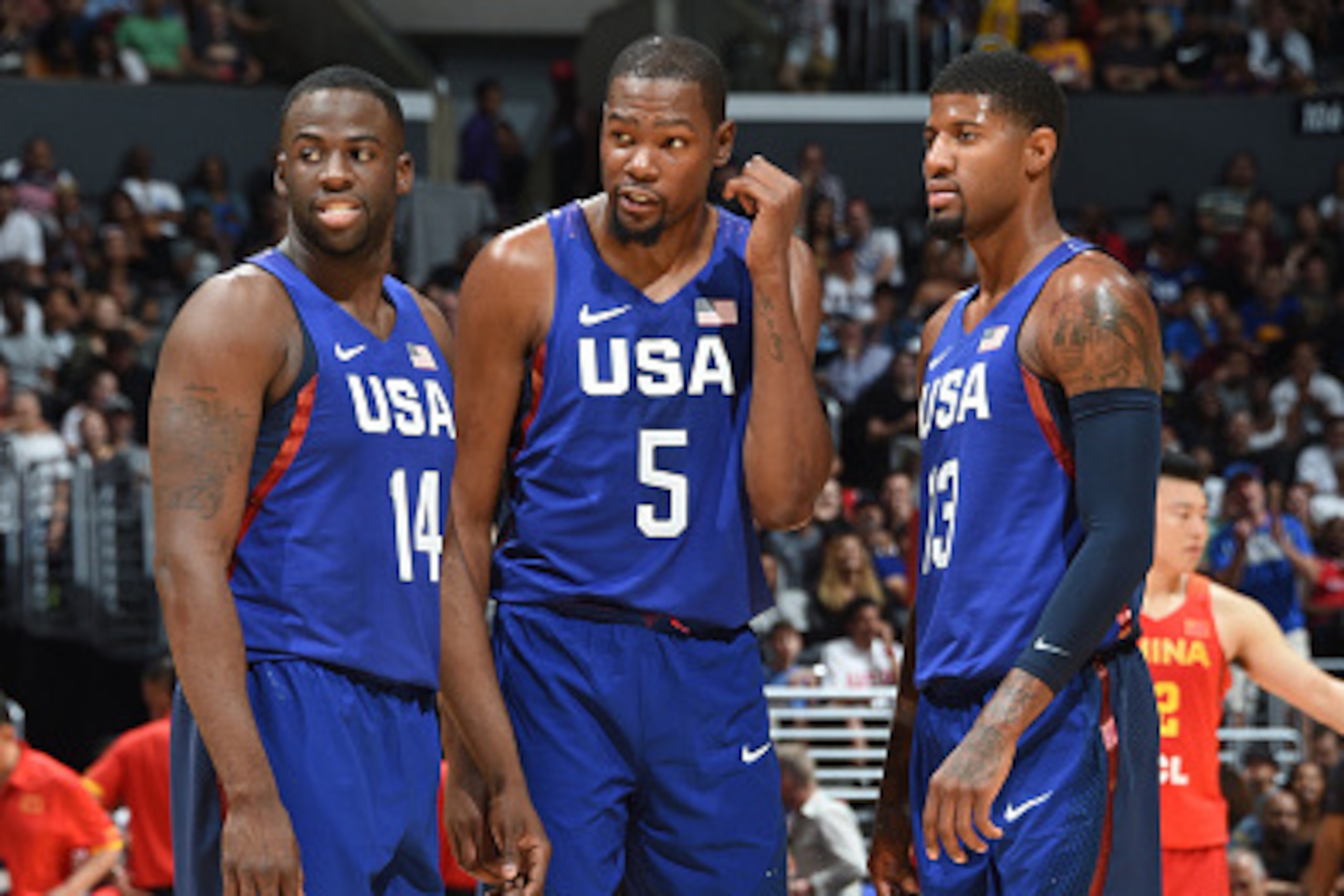 LOS ANGELES, CA - JULY 24: Draymond Green #14, Kevin Durant #5 and Paul George #13 of the USA Basketball Men's National Team are seen against China at the Staples Center in Los Angeles, California. NOTE TO USER: User expressly acknowledges and agrees that