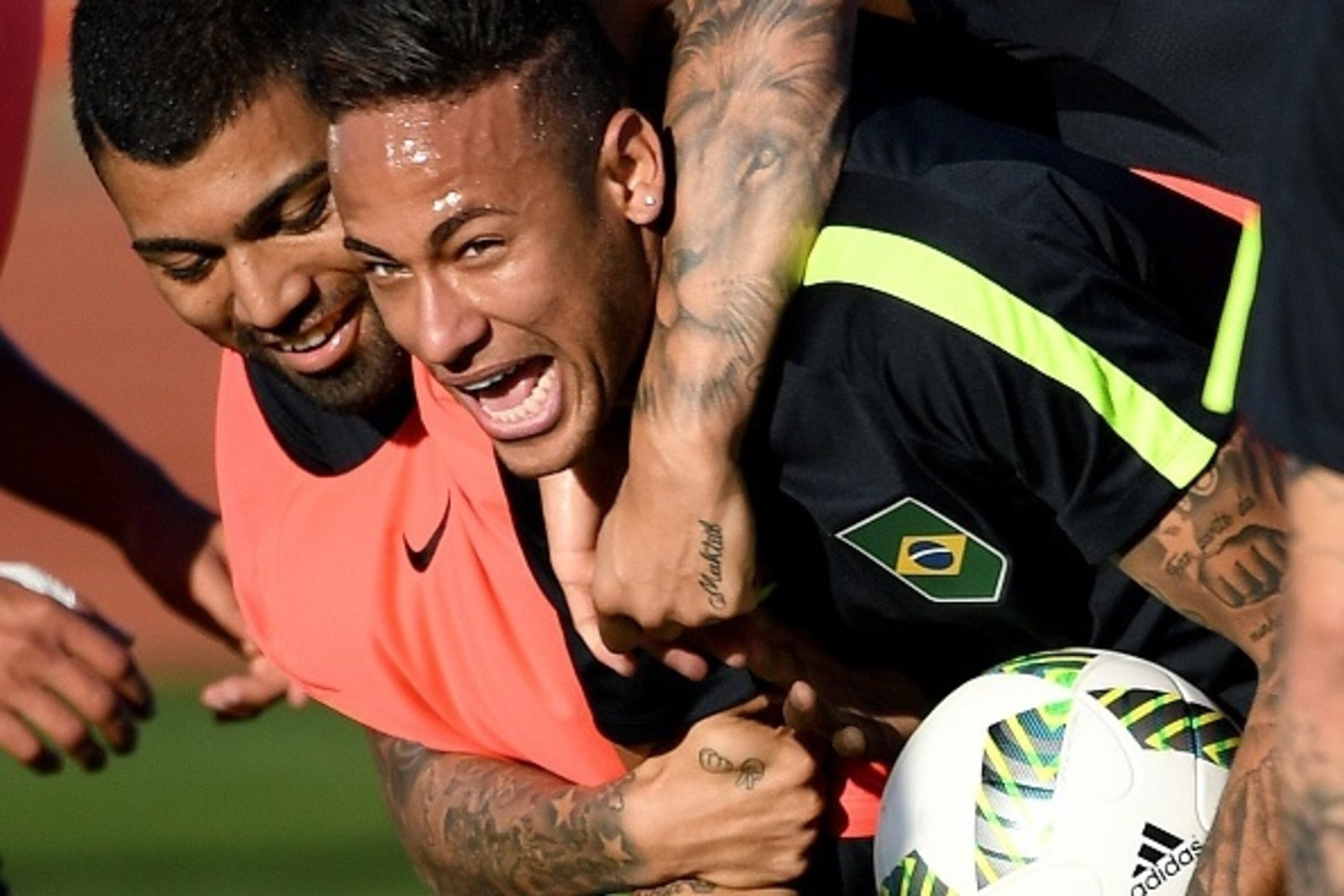 Brazilian footballers Neymar (R) and Gabriel Jesus joke during a training session at the Fire Department Training Center in Brasilia, on August 1, 2016.
The Rio 2016 Olympic and Paralympic Games will be held in Brazil from August 5-21 and September 7-18 r
