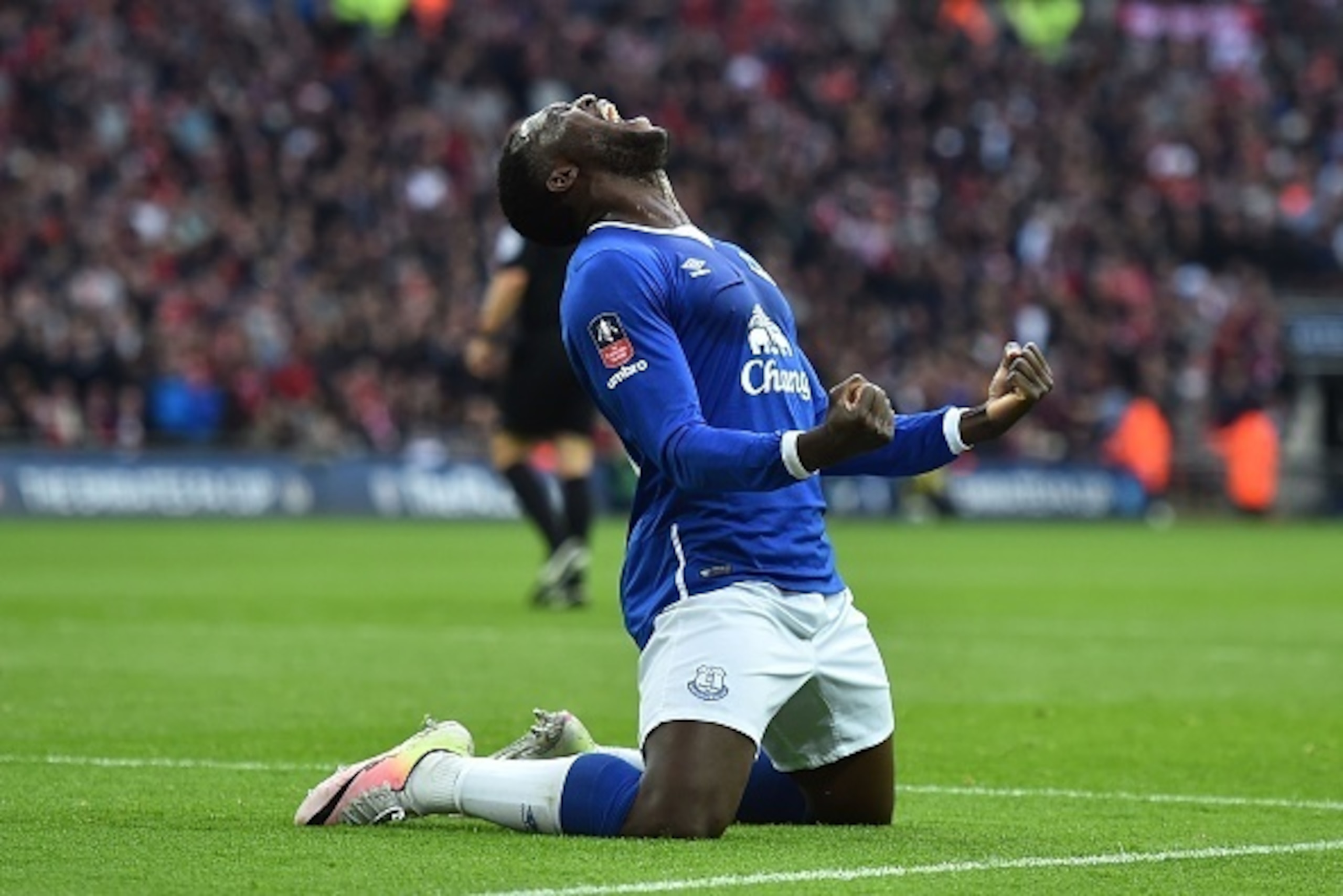 Everton's Belgian striker Romelu Lukaku celebrates after Manchester United's English defender Chris Smalling turned in a cross from Everton's Spanish midfielder Gerard Deulofeu to score an own goal to equalise the scores 1-1 during the English FA Cup semi