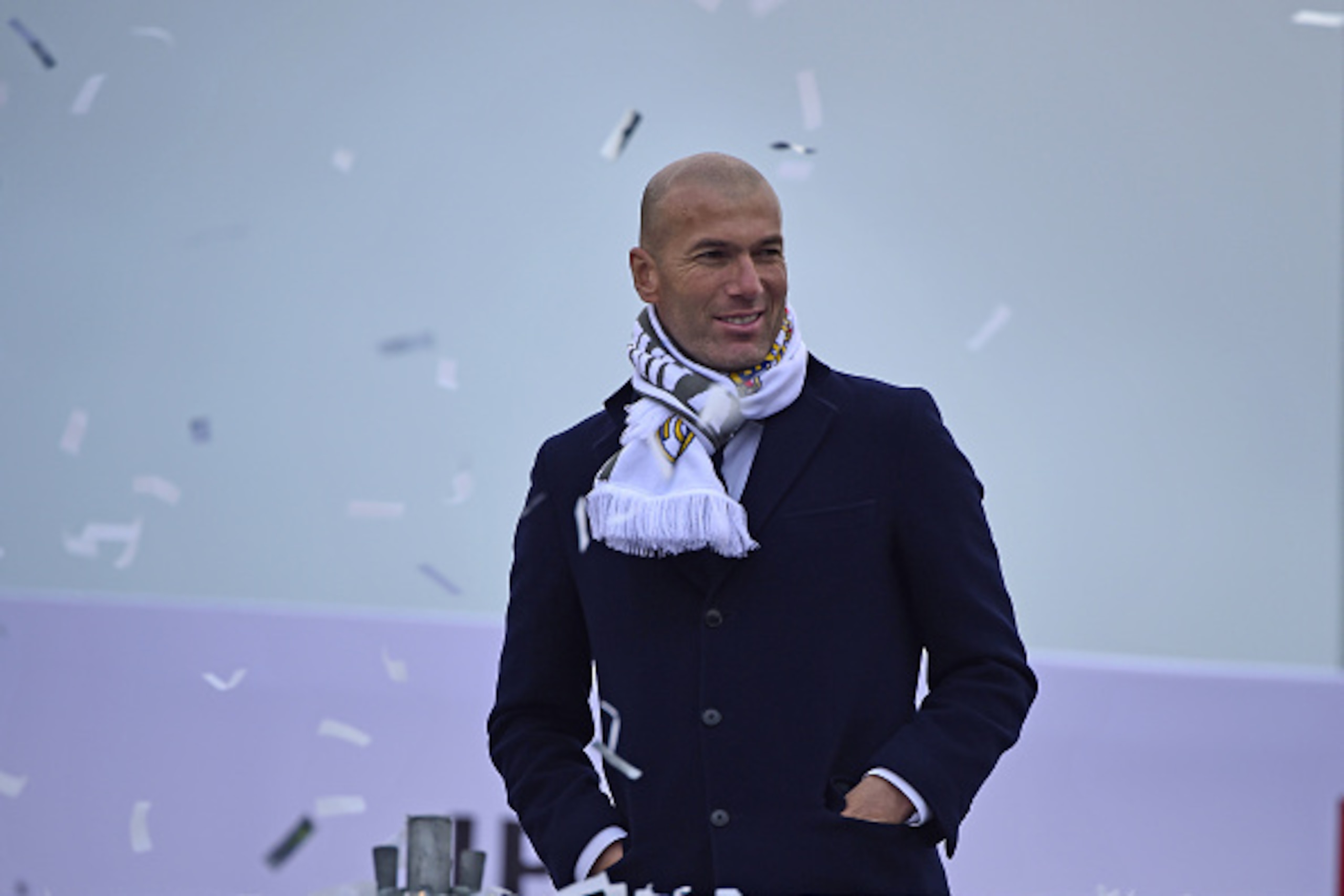 Real Madrid's French coach Zinedine Zidane celebrates the team's win on Plaza Cibeles in Madrid on May 29, 2016 after the UEFA Champions League final foobtall match between Real Madrid CF, Club Atletico de Madrid held in Milan, Italy. / AFP / JAVIER SORIA