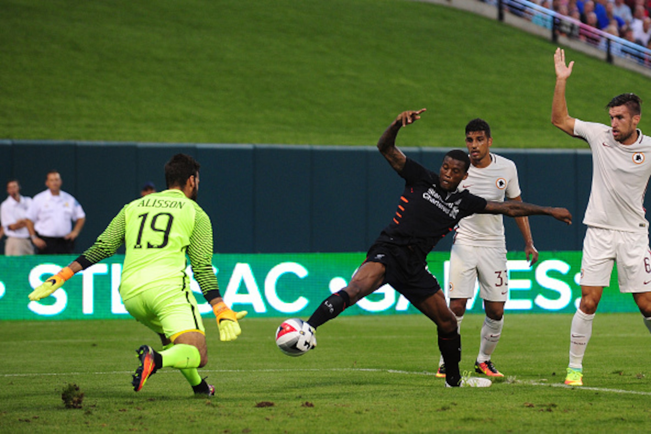 ST LOUIS, MO - AUGUST 01: Georginio Wijnaldum #5 of Liverpool FC shoots as Becker Alisson #19 of AS Roma defends during a friendly match at Busch Stadium on August 1, 2016 in St Louis, Missouri. AC Roma won 2-1. (Photo by Jeff Curry/Getty Images)