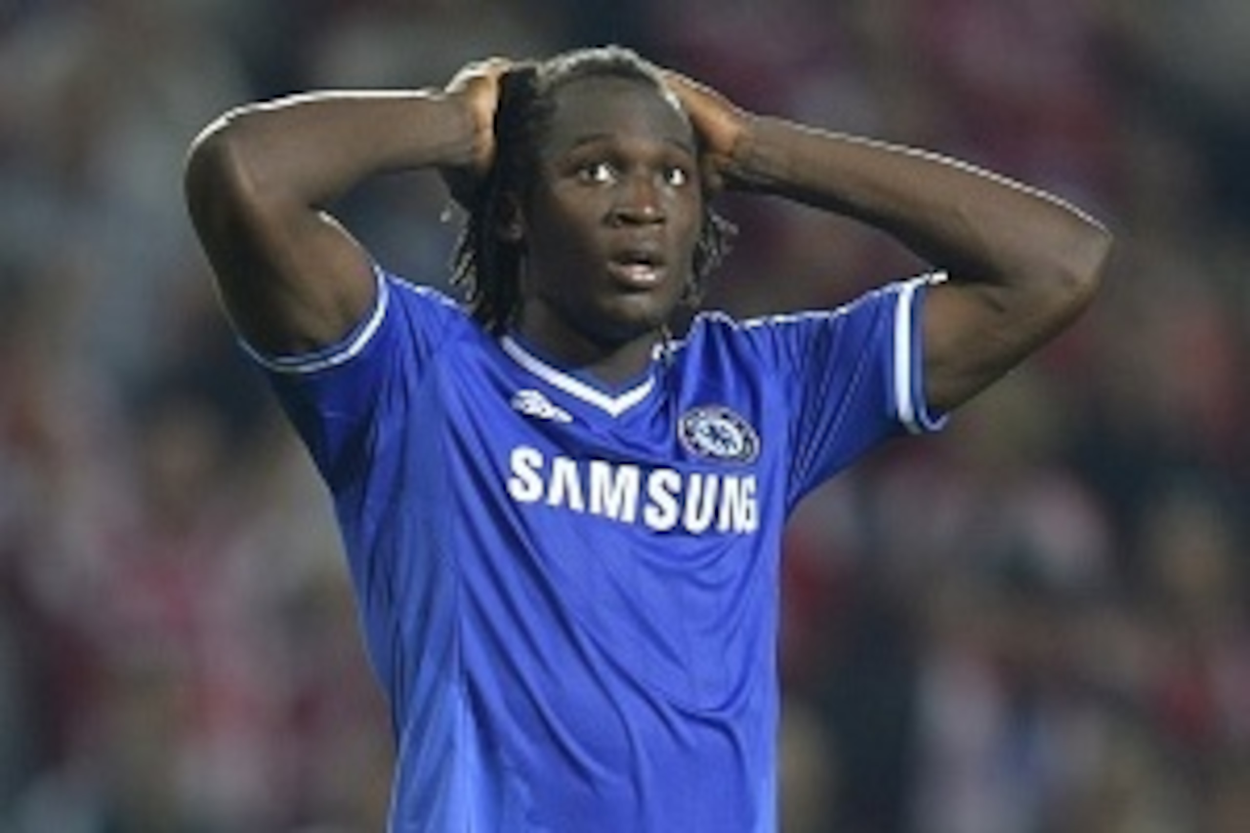 Chelsea's Romelu Lukaku reacts after missing a penalty during the penalty shootout during the UEFA Super Cup football match FC Bayern Munich vs Chelsea FC on August 30, 2013 at the Eden Stadium, in Prague. AFP PHOTO / ODD ANDERSEN        (Photo credit sho