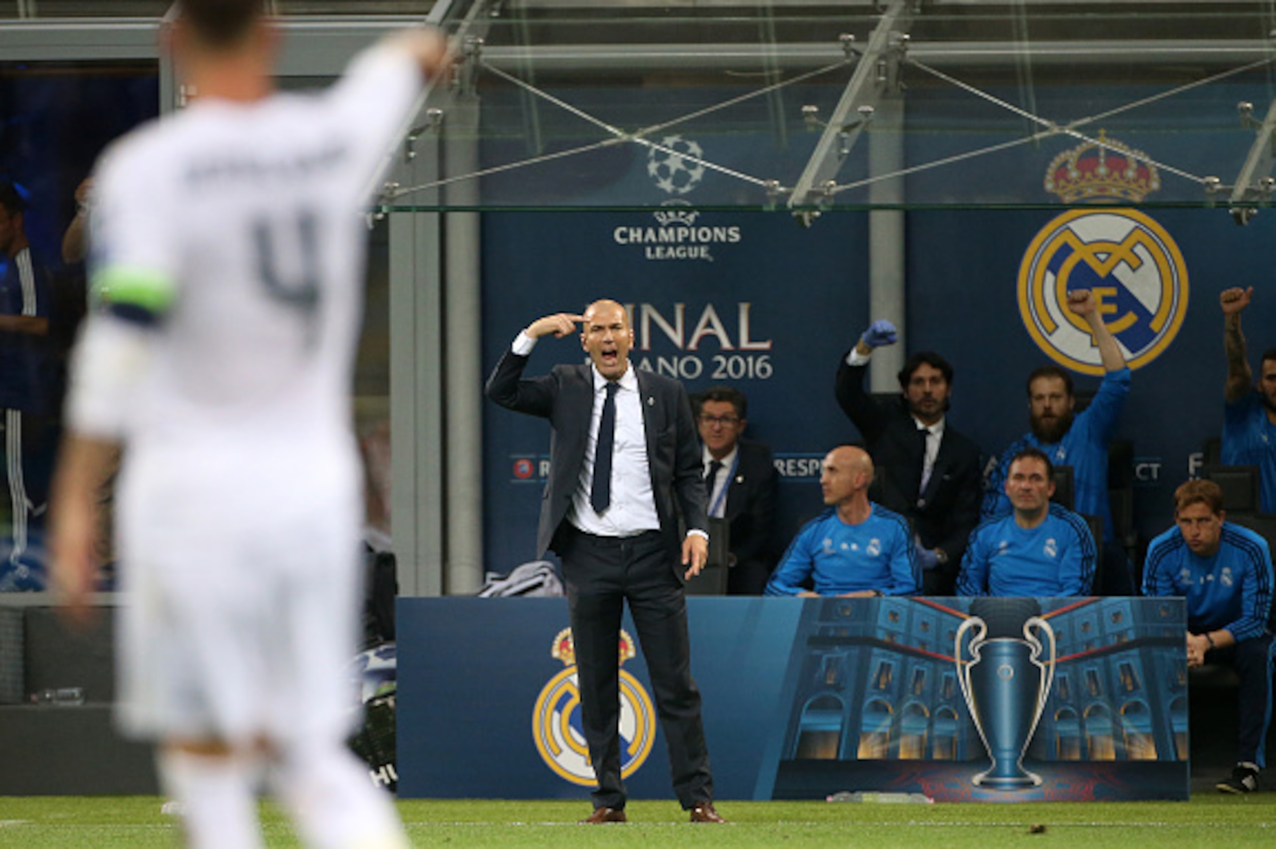 MILAN, ITALY - MAY 28: Coach of Real Madrid Zinedine Zidane greets Sergio Ramos (#4) for his goal during the UEFA Champions League final between Real Madrid and Club Atletico Madrid at Stadio Giuseppe Meazza, San Siro on May 28, 2016 in Milan, Italy. (Pho
