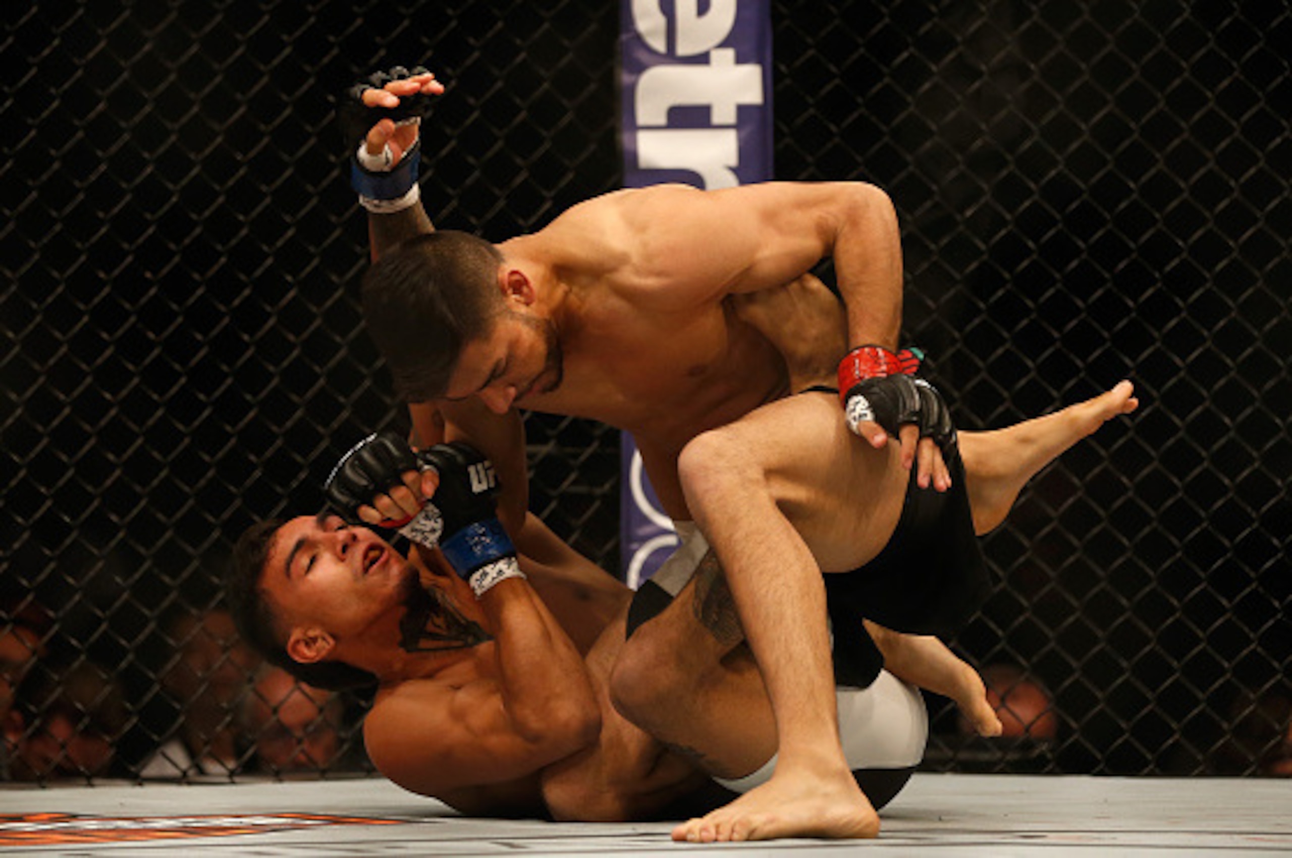 LAS VEGAS, NV - APRIL 23: (Top) Yair Rodriguez grapples with Andre Fili in their featherweight bout during the UFC 197 event inside MGM Grand Garden Arena on April 23, 2016 in Las Vegas, Nevada. (Photo by Christian Petersen/Zuffa LLC/Zuffa LLC via Getty LAS VEGAS, NV - APRIL 23: (Top) Yair Rodriguez grapples with Andre Fili in their featherweight bout during the UFC 197 event inside MGM Grand Garden Arena on April 23, 2016 in Las Vegas, Nevada. (Photo by Christian Petersen/Zuffa LLC/Zuffa LLC via Getty
