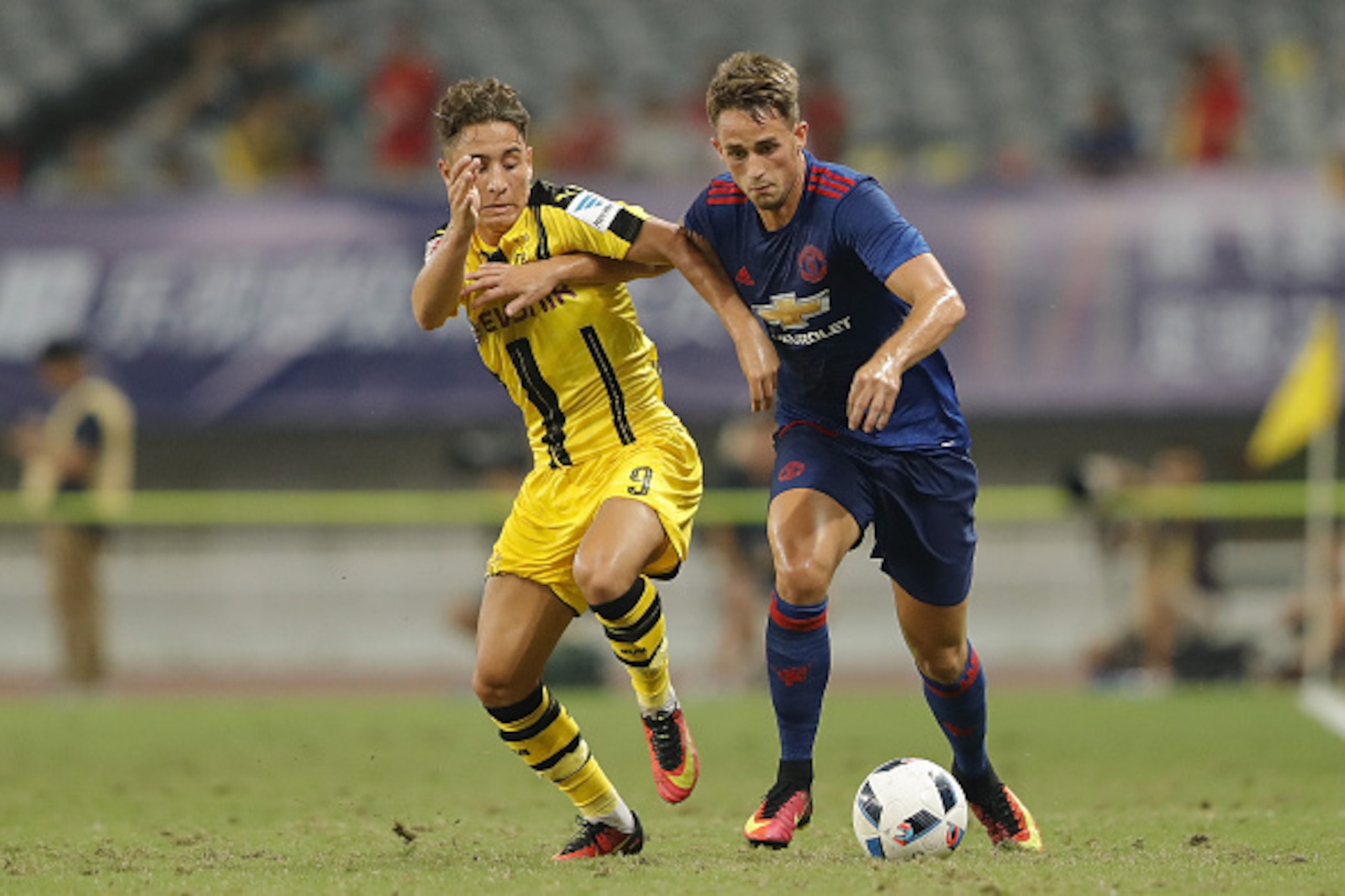 SHANGHAI, CHINA - JULY 22: Adnan Januzaj (R) of Manchester United competes for the ball with Jacob Bruun Larsen of Borussia Dortmund
during the International Champions Cup match between Manchester United and Borussia Dortmund at Shanghai Stadium on July SHANGHAI, CHINA - JULY 22: Adnan Januzaj (R) of Manchester United competes for the ball with Jacob Bruun Larsen of Borussia Dortmund
during the International Champions Cup match between Manchester United and Borussia Dortmund at Shanghai Stadium on July