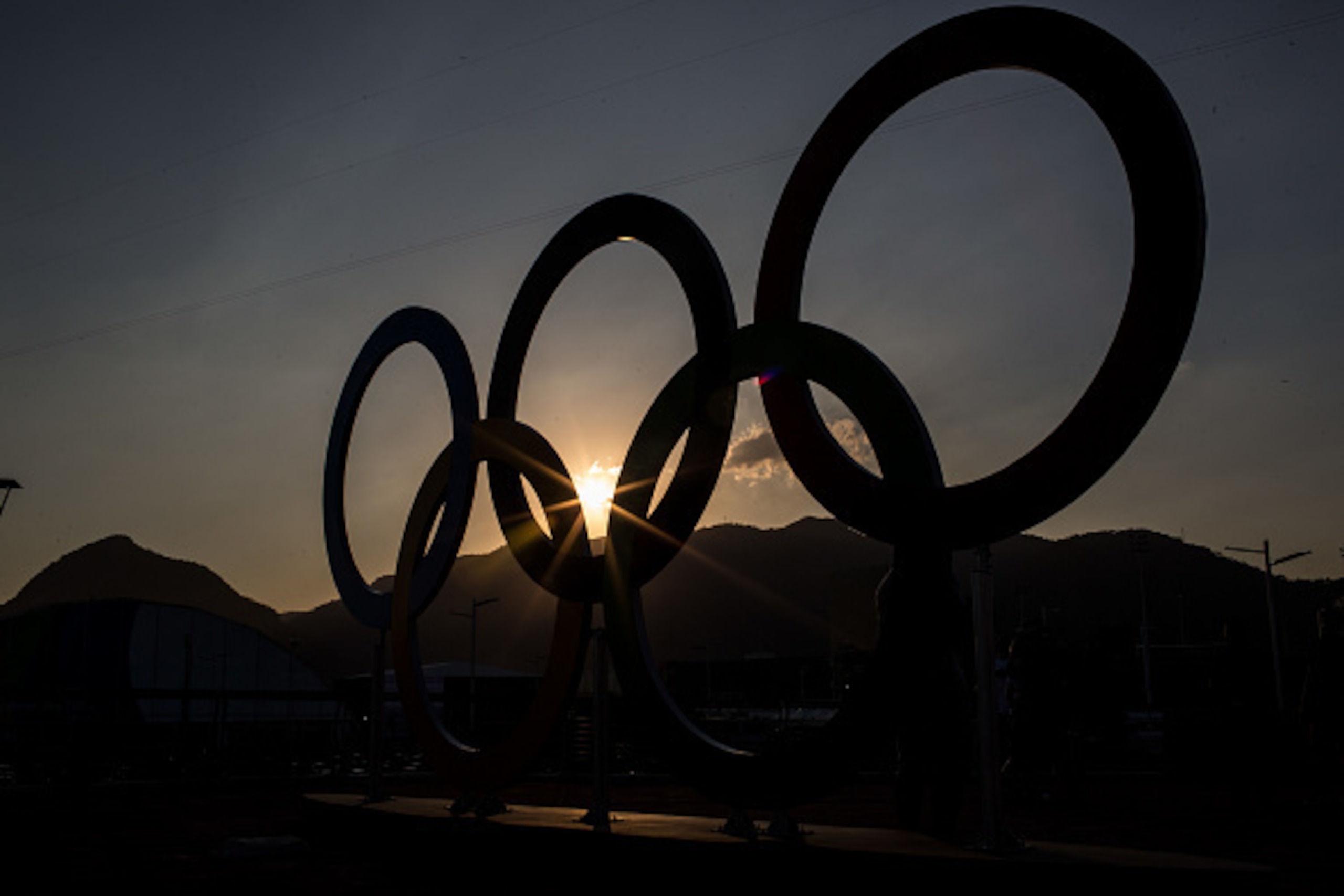 RIO DE JANEIRO, BRAZIL - AUGUST 01:  The sunsets behind the Olympic rings in Olympic Park ahead of the Rio 2016 Olympic Games on August 1, 2016 in Rio de Janeiro, Brazil. The games commence on August 5.  (Photo by Chris McGrath/Getty Images)