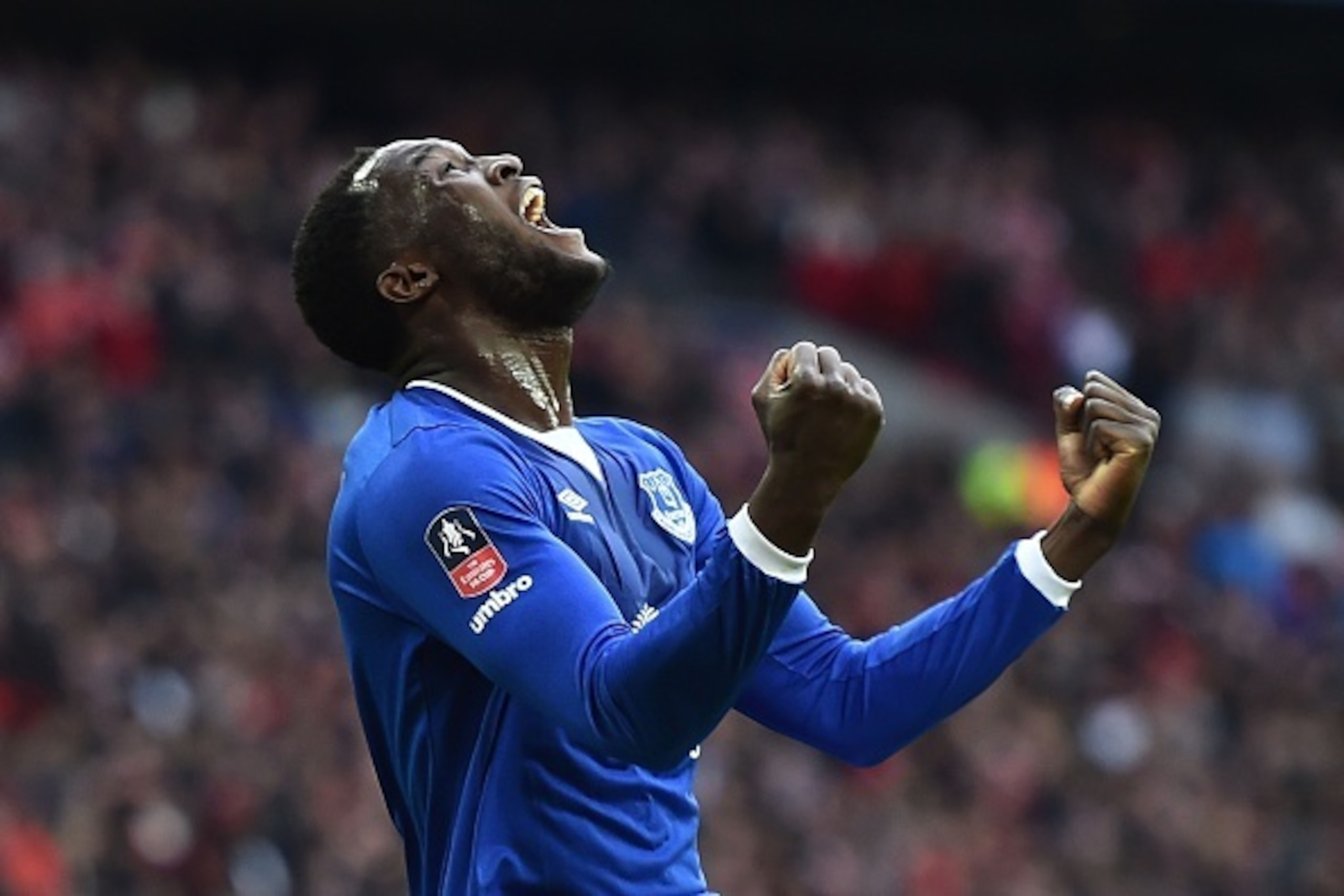 Everton's Belgian striker Romelu Lukaku celebrates after Manchester United's English defender Chris Smalling turned in a cross from Everton's Spanish midfielder Gerard Deulofeu to score an own goal to equalise the scores 1-1 during the English FA Cup semi