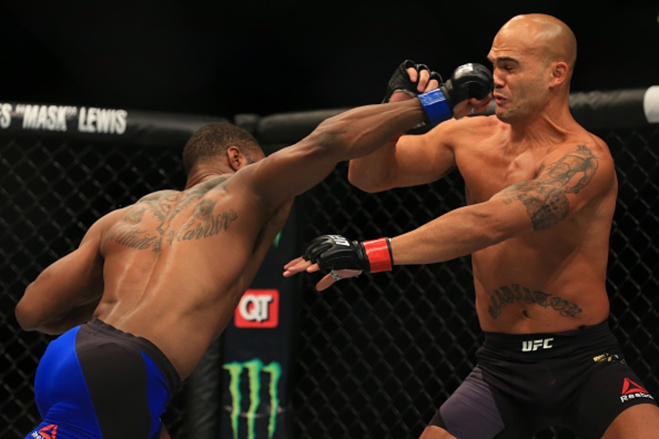 ATLANTA, GA - JULY 30:  (L-R) Tyron Woodley delivers a right hand to knock down opponent Robbie Lawler in their welterweight championship bout during the UFC 201 event on July 30, 2016 at Philips Arena in Atlanta, Georgia. (Photo by Daniel Shirey/Zuffa LL